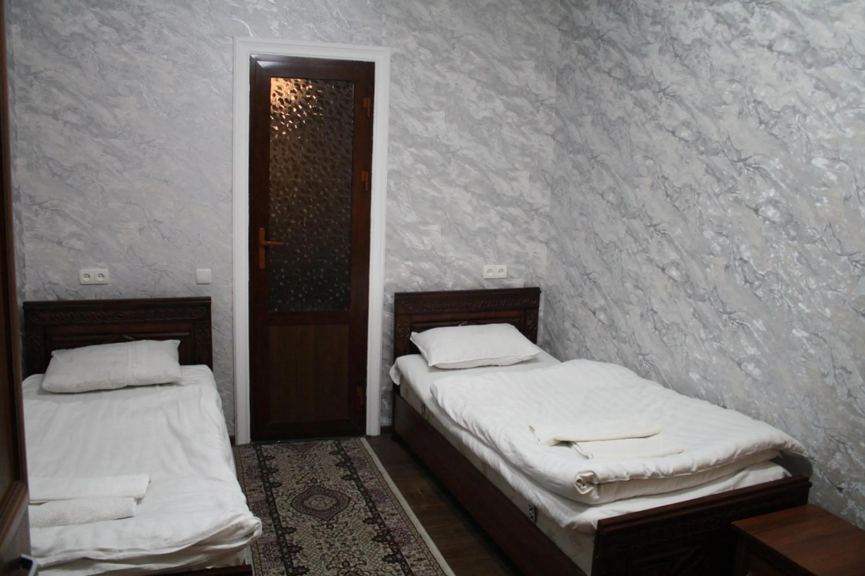 Bed in Tilyakori Hotel