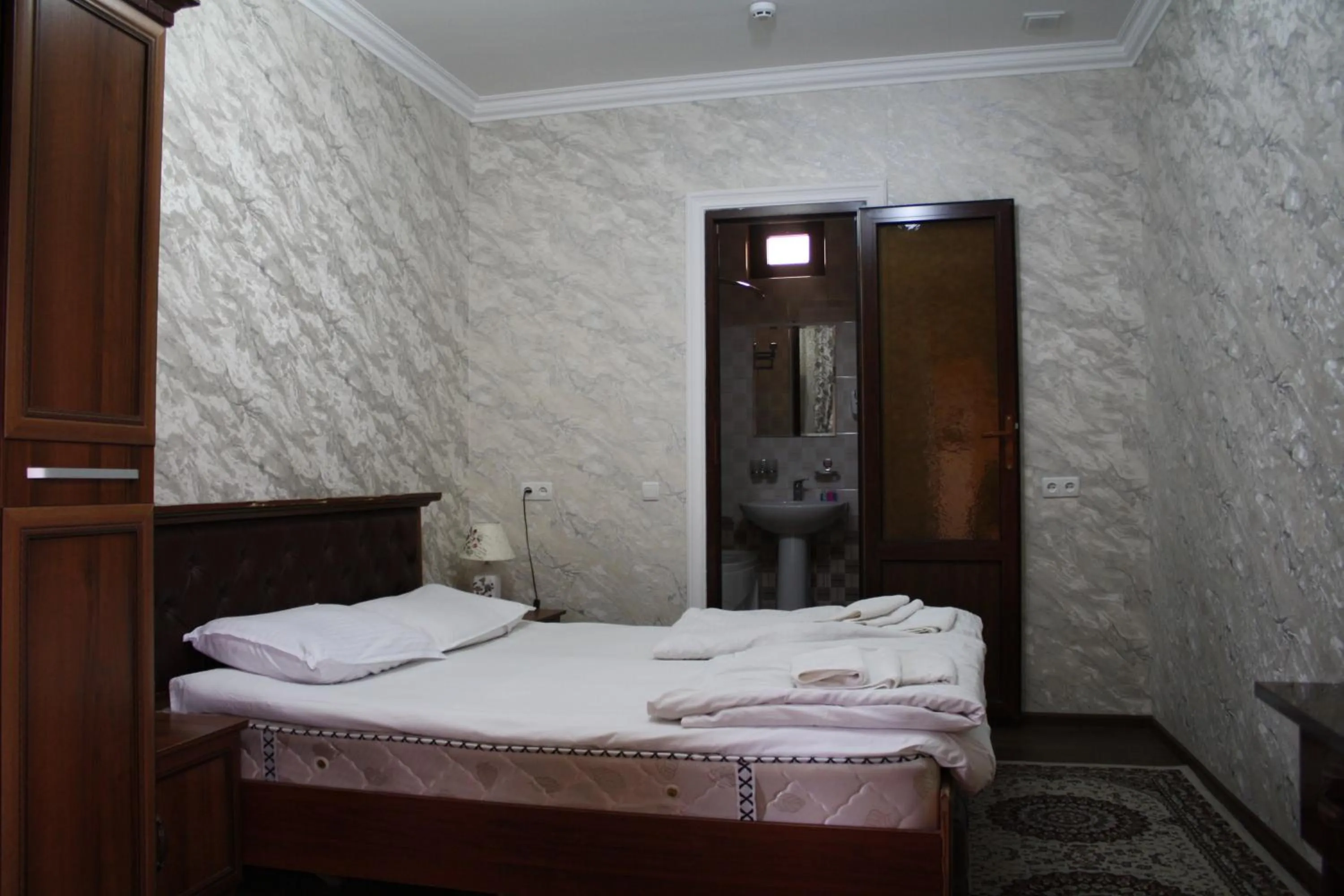 Bed in Tilyakori Hotel