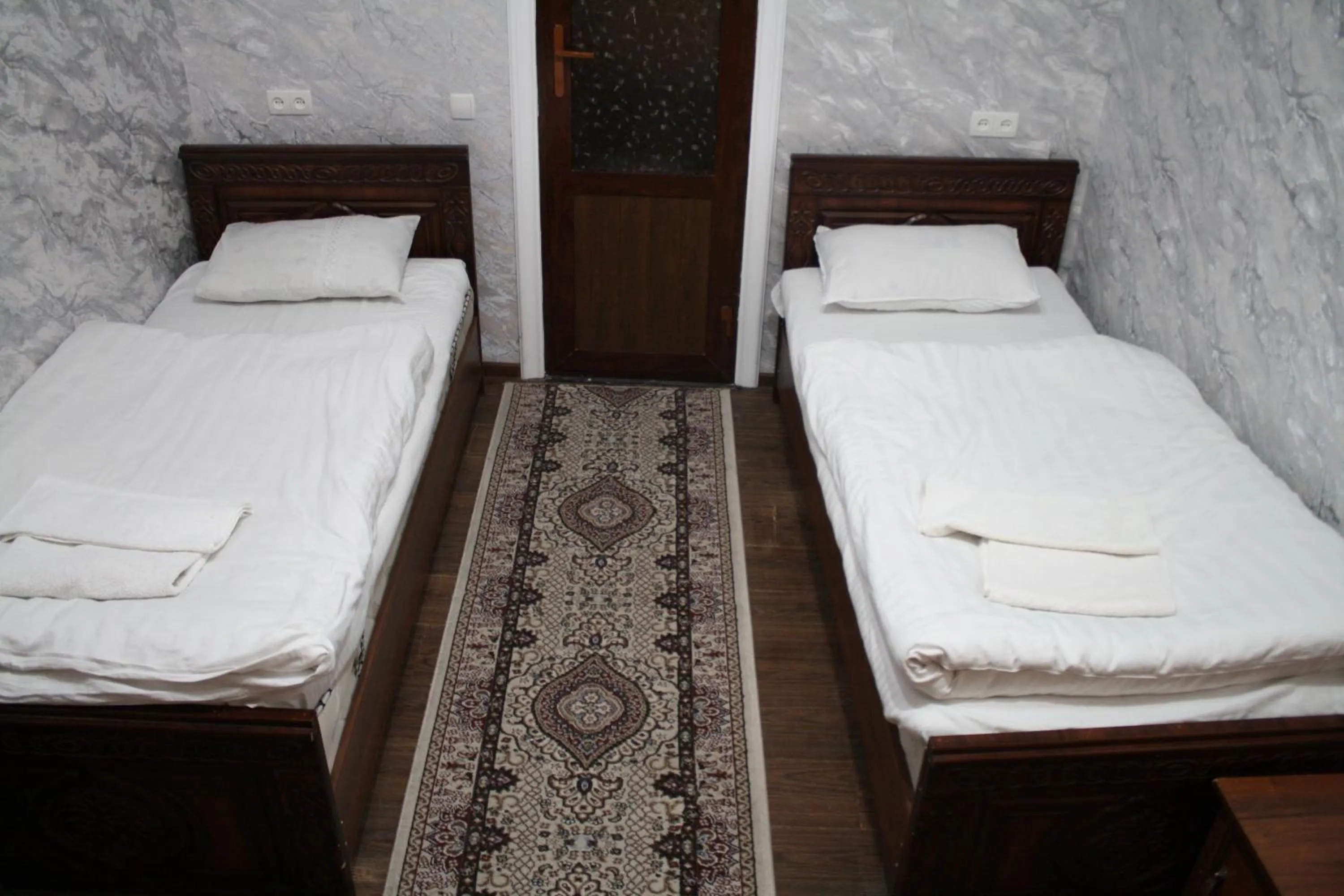 Bed in Tilyakori Hotel