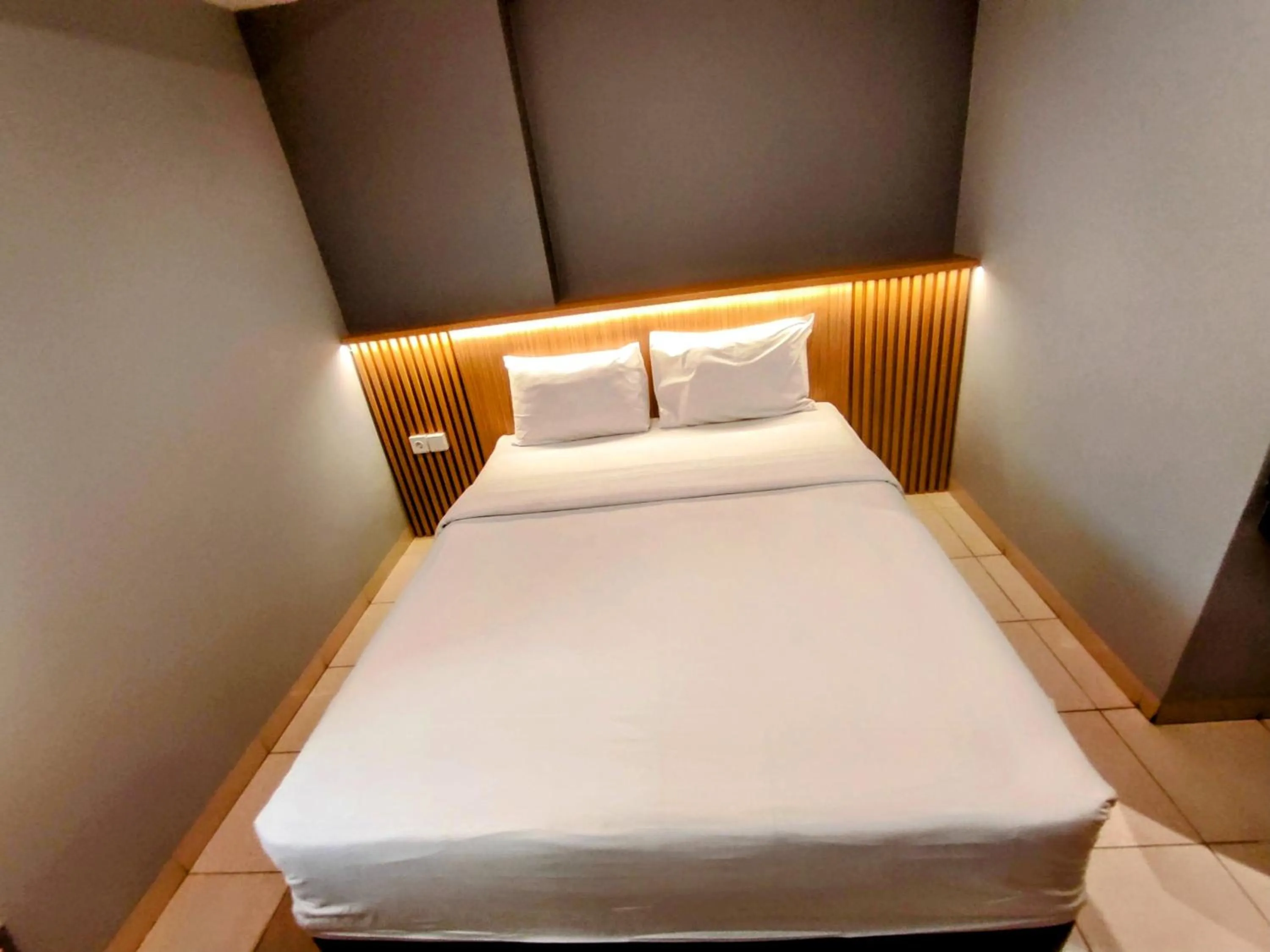 Bed in Studio One Thamrin Hotel