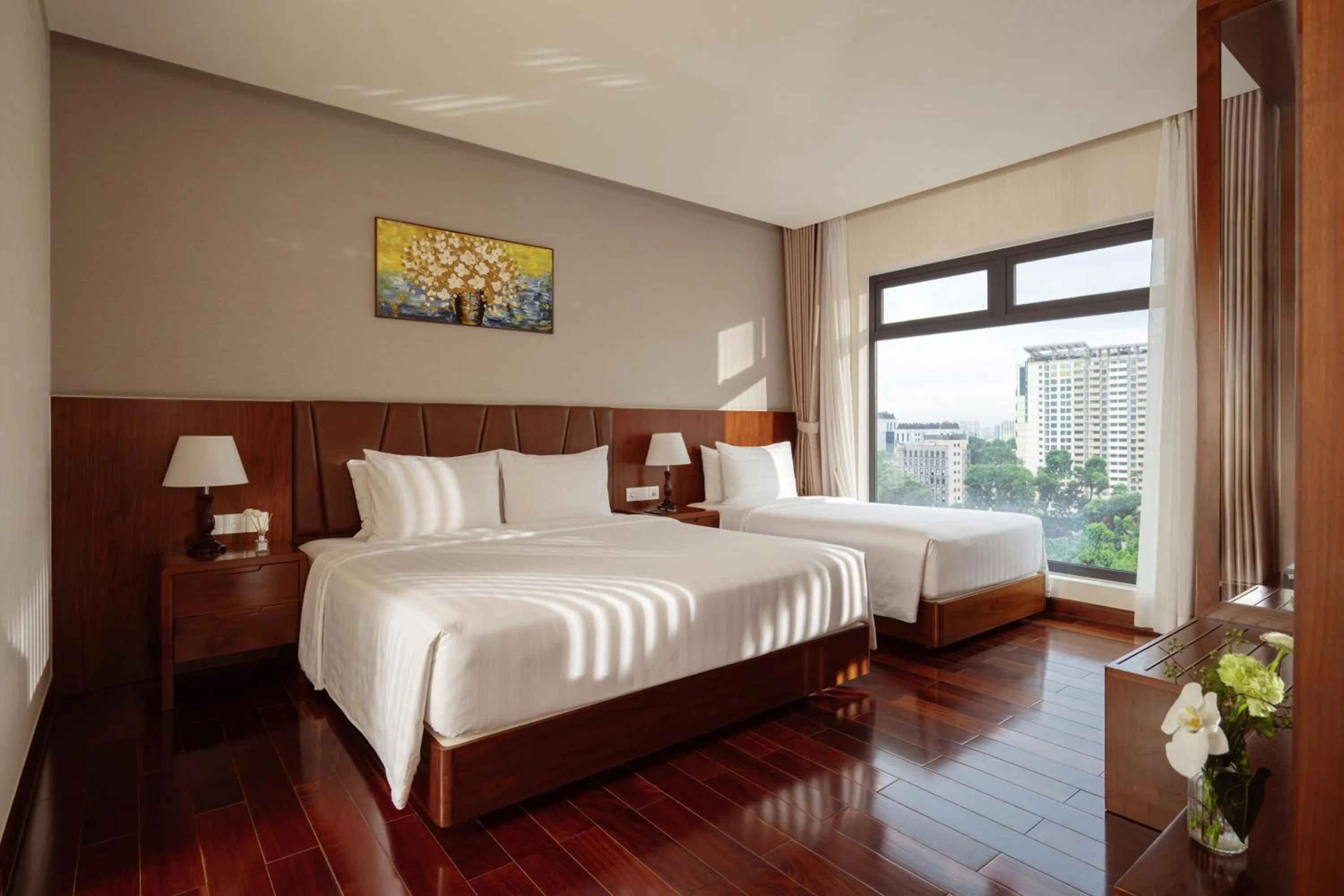 Bed in Orchids Saigon Hotel