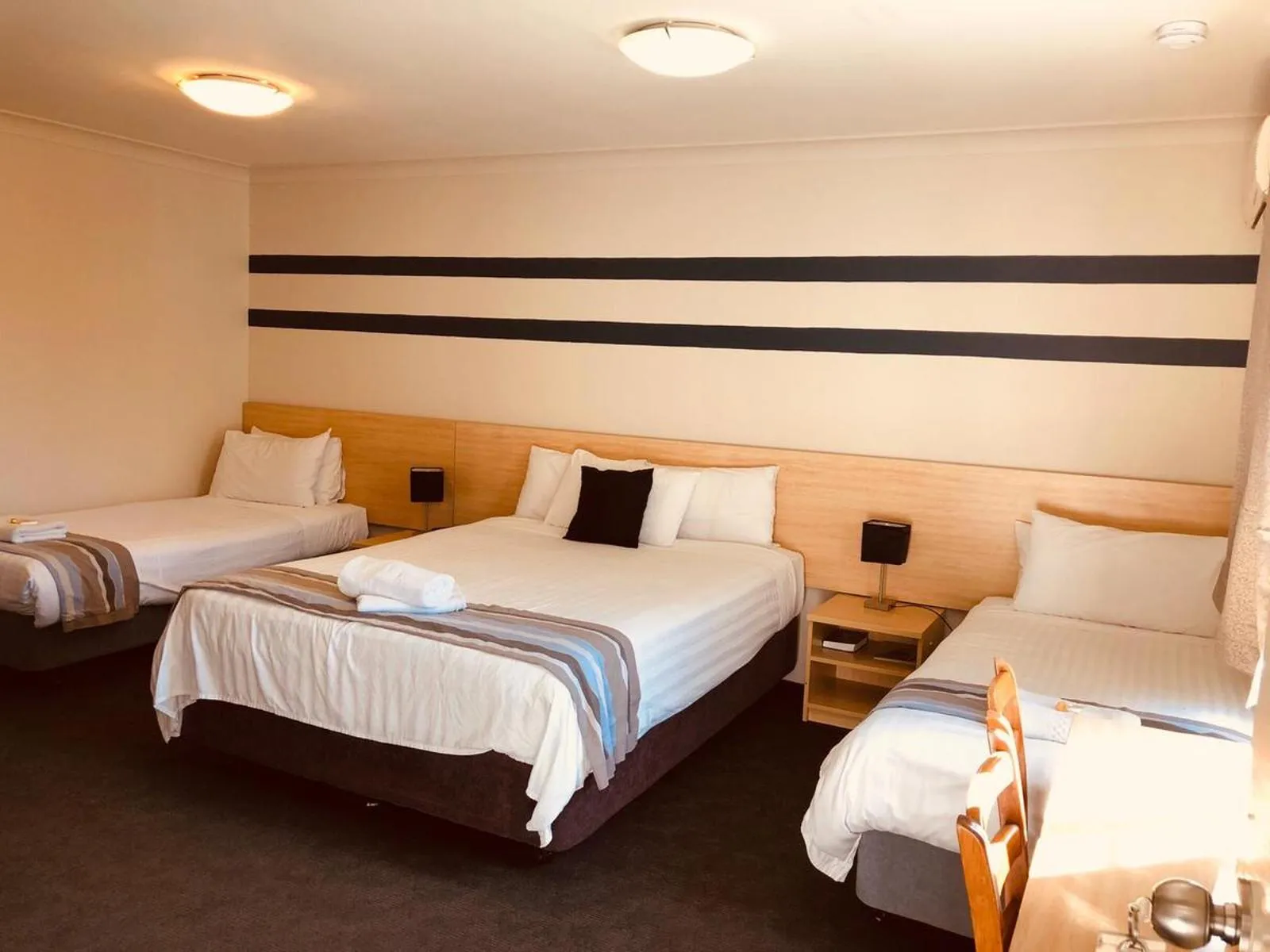 Bed in Red Cedar Motel