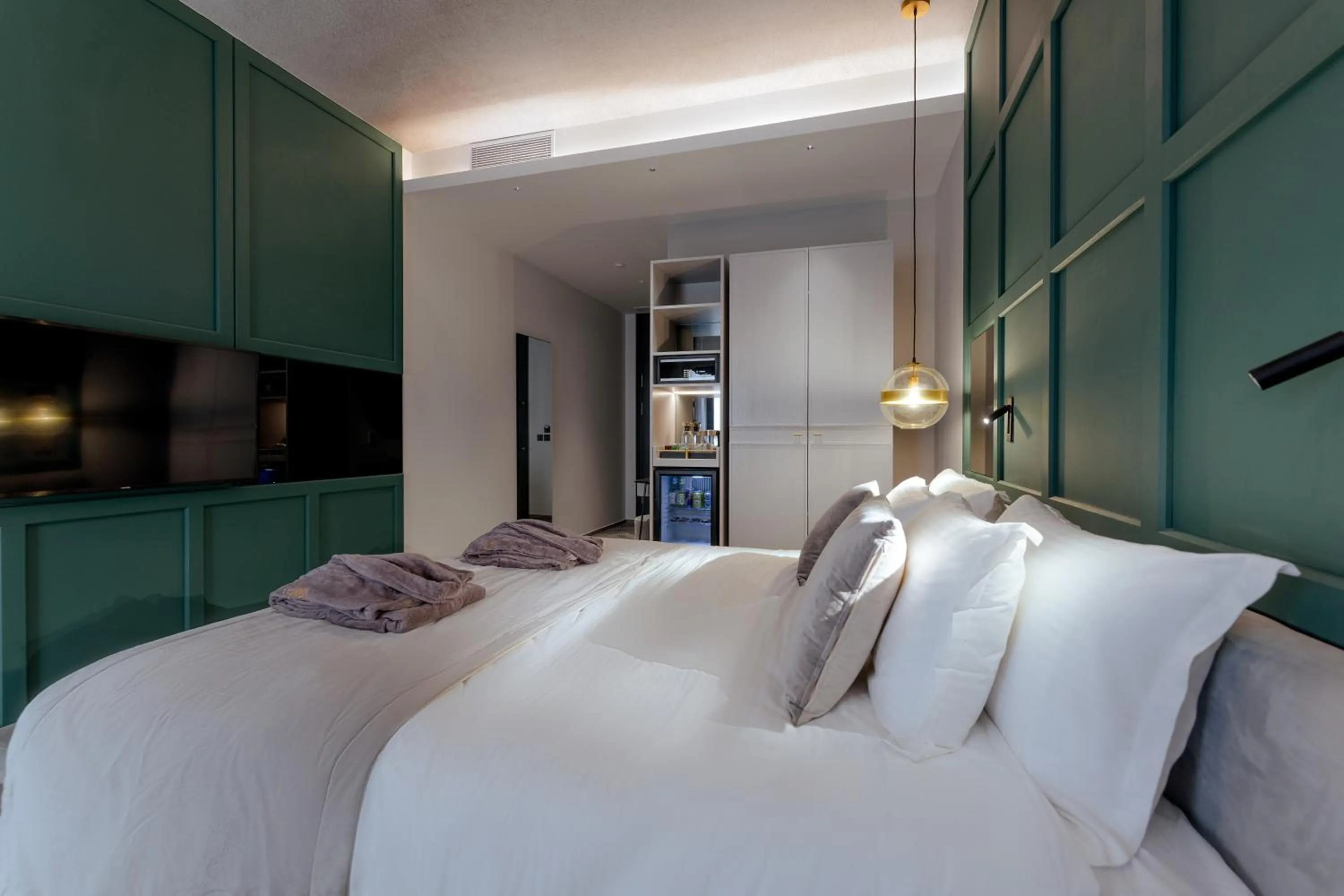 Bed in The Embassy Valletta Hotel