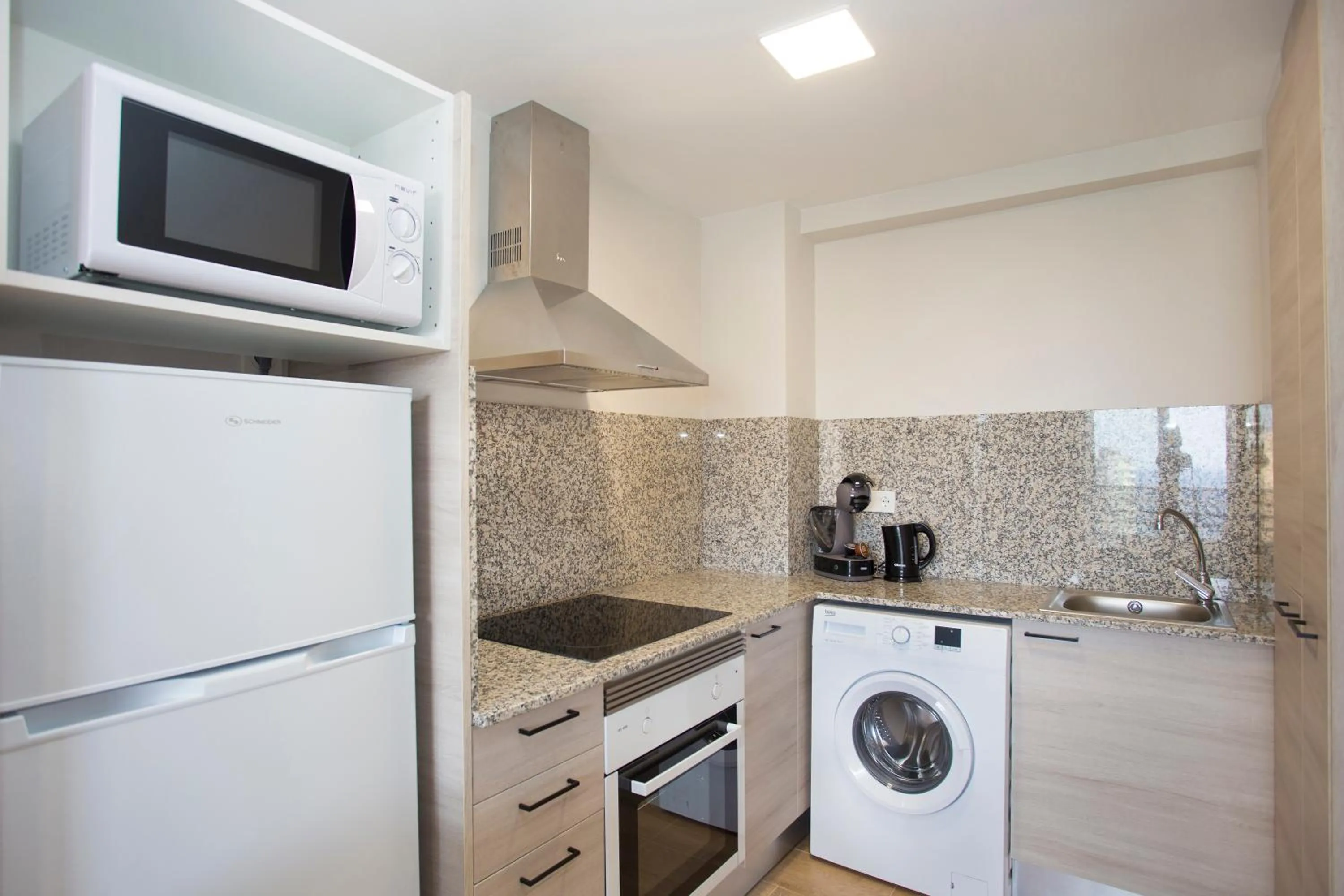 Kitchen or kitchenette in Apartamentos Maryciel By Mc