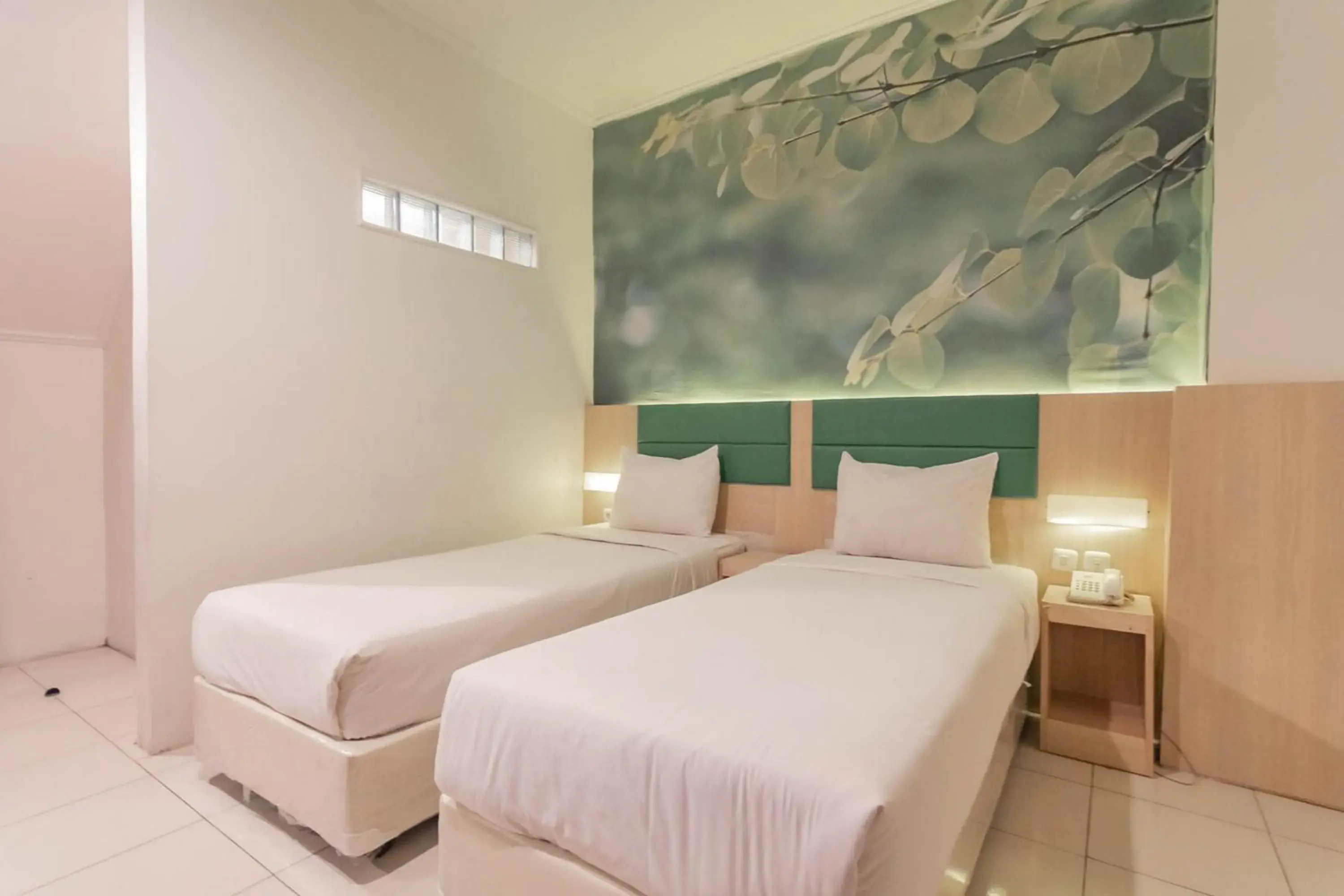 Bed in RedDoorz At Hotel Arimbi Dewi Sartika Baru Bed in RedDoorz At Hotel Arimbi Dewi Sartika Baru