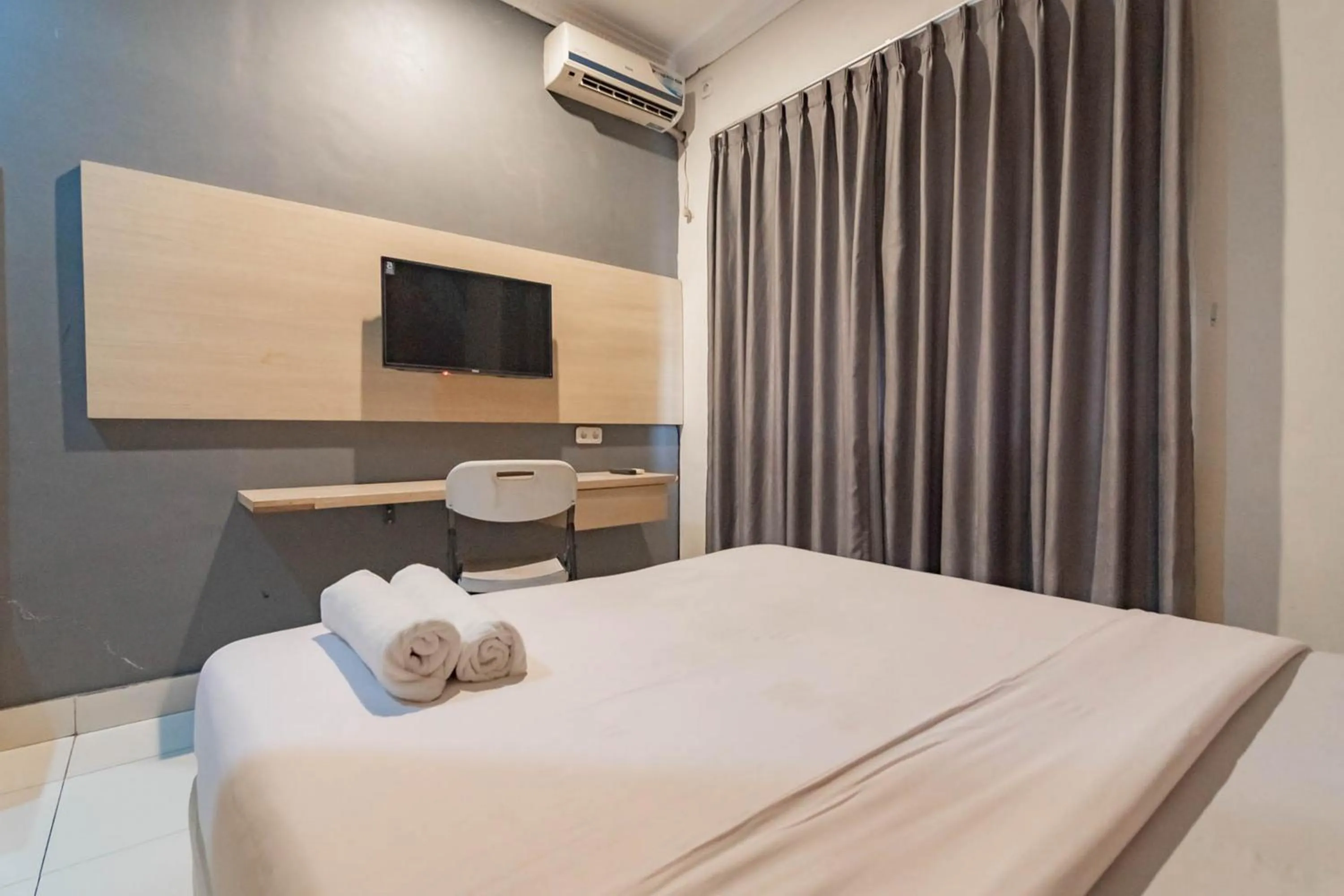 Bed in RedDoorz At Hotel Arimbi Dewi Sartika Baru