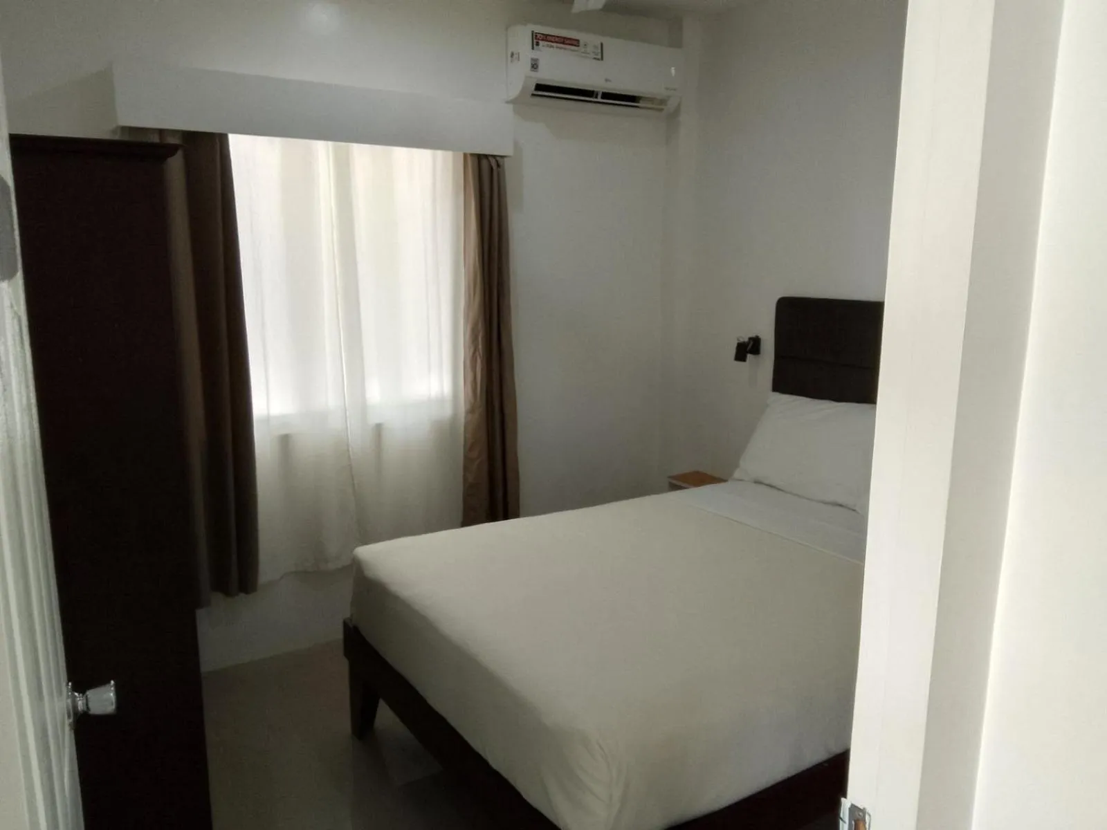 Bed in Heartland Hotel Serviced Rooms & Apartments.