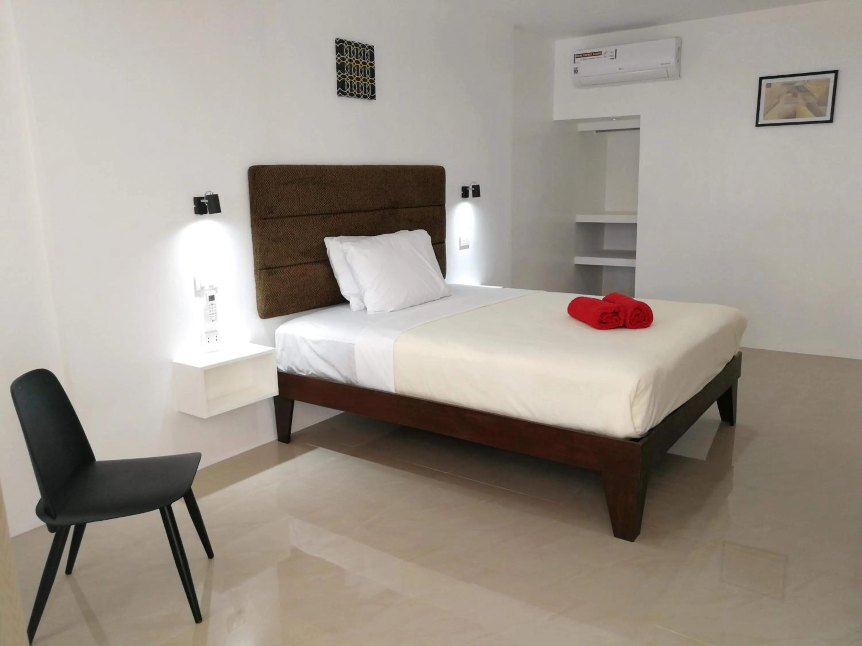 Bed in Heartland Hotel Serviced Rooms & Apartments.