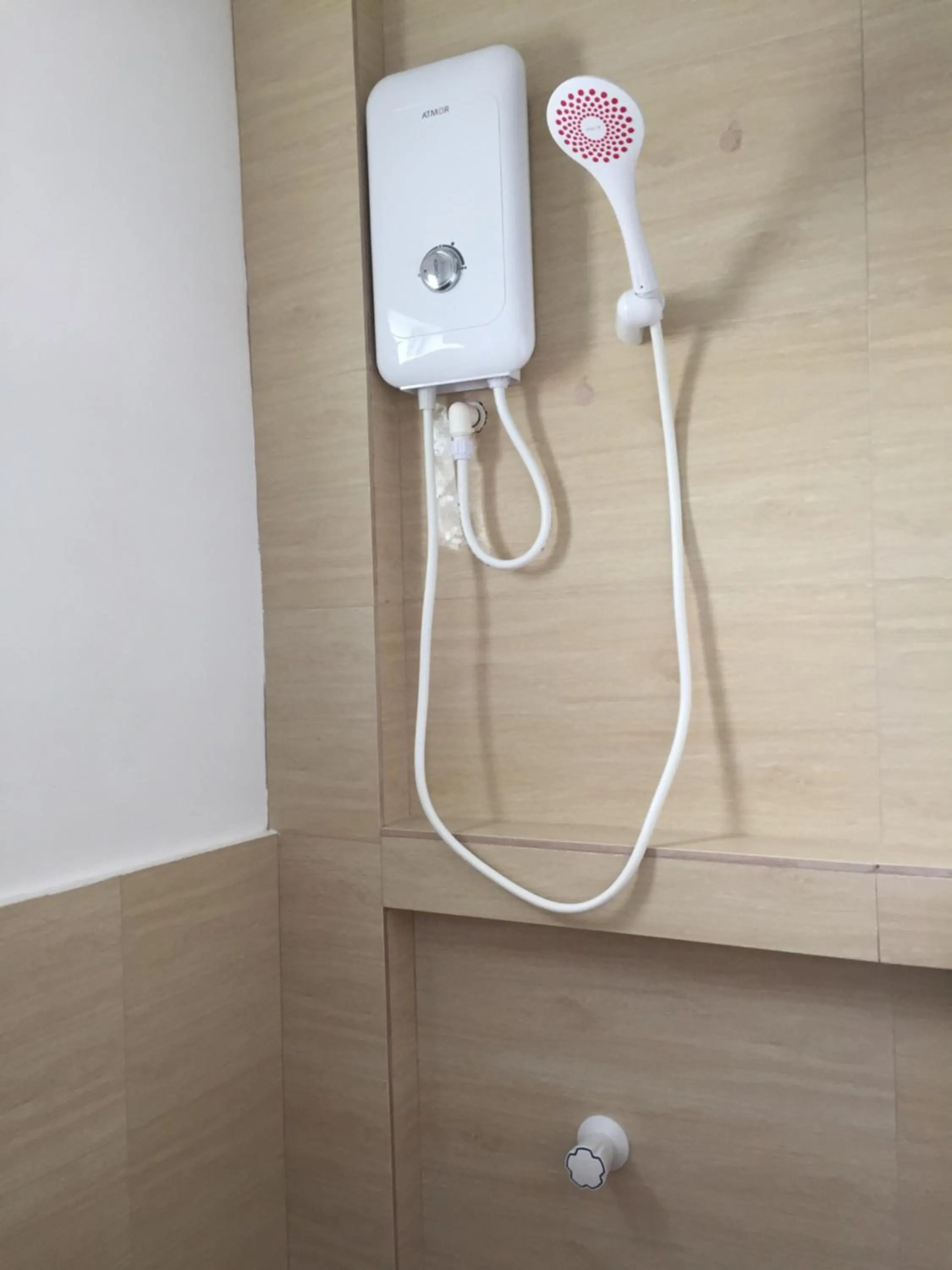 Shower in Heartland Hotel Serviced Rooms & Apartments.