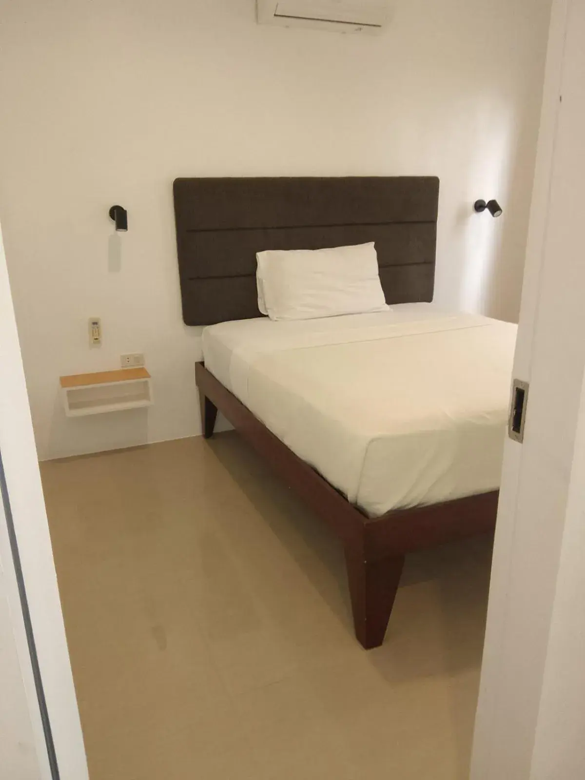 Bedroom, Bed in Heartland Hotel Serviced Rooms & Apartments. Bedroom, Bed in Heartland Hotel Serviced Rooms & Apartments.
