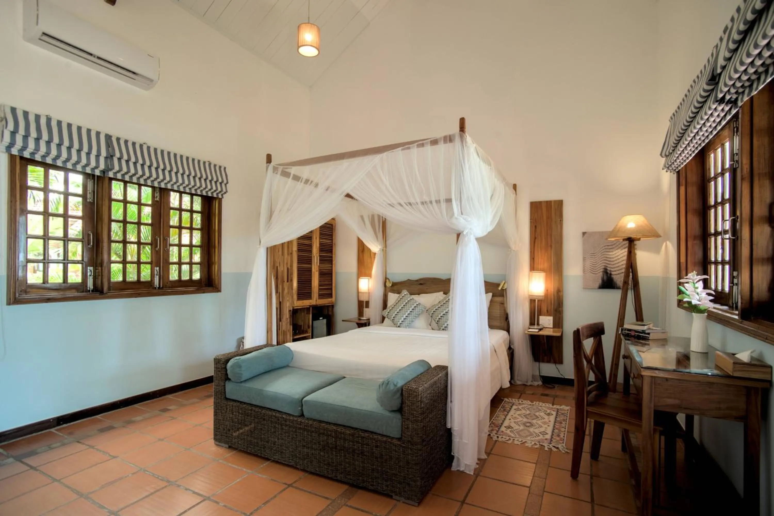 Bed in Cassia Cottage Resort and Spa