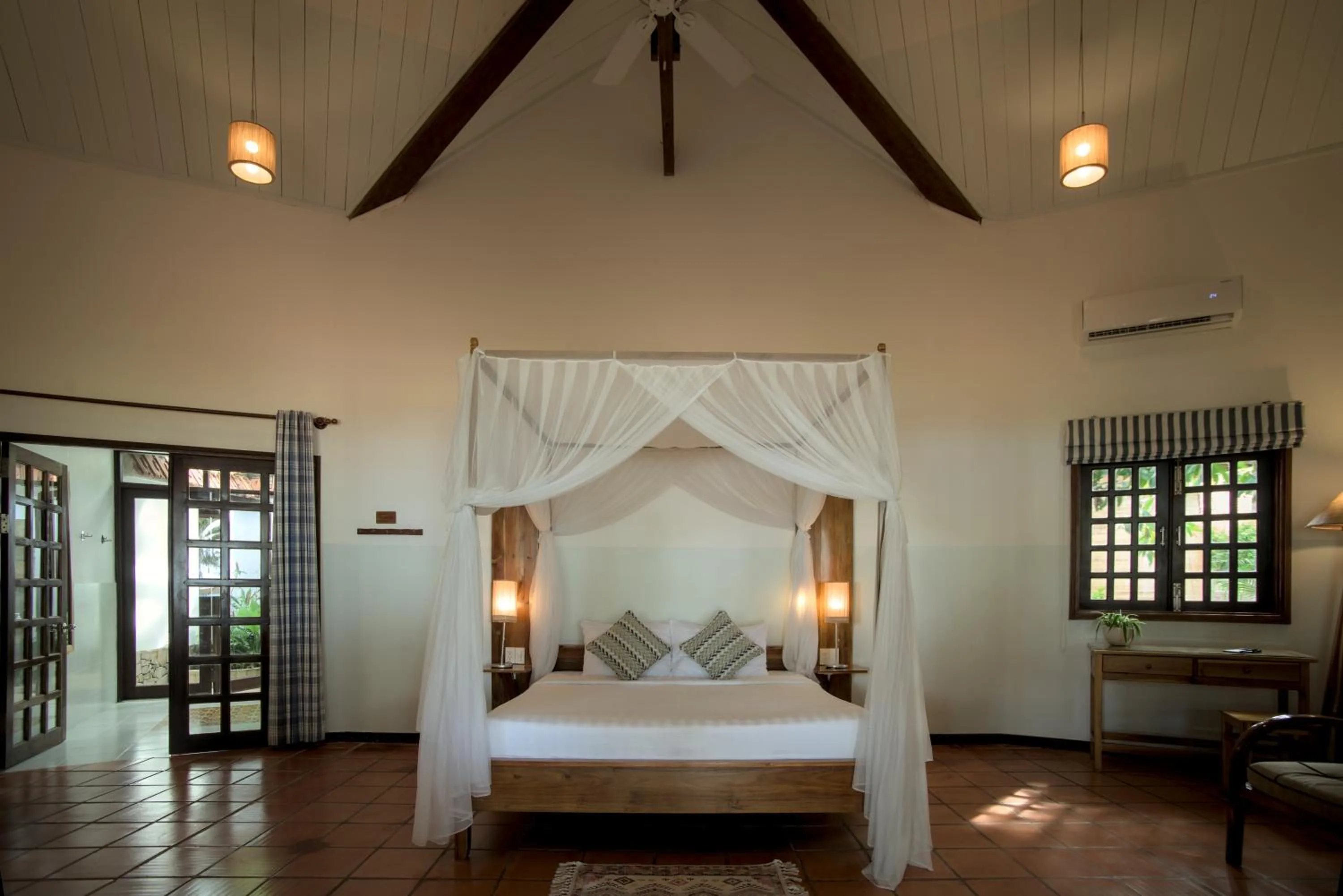 Bed in Cassia Cottage Resort and Spa