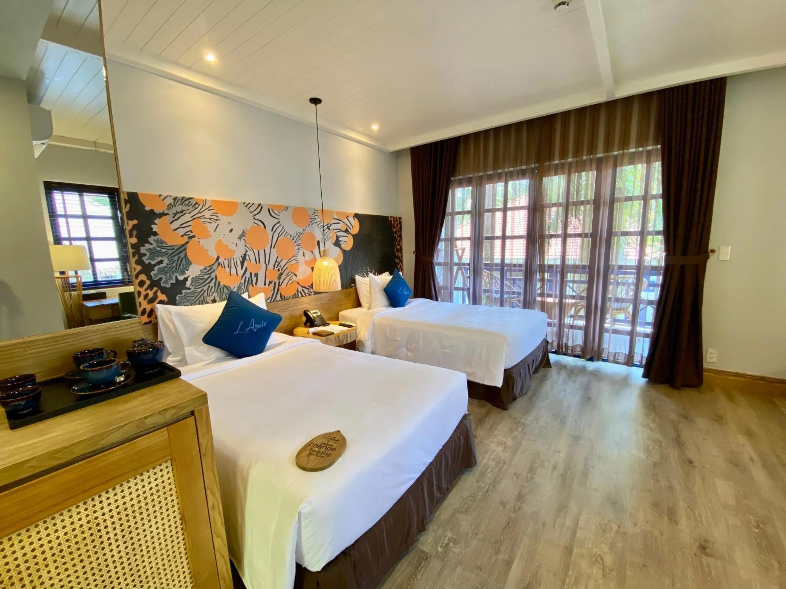 Bed in L'Azure Resort and Spa