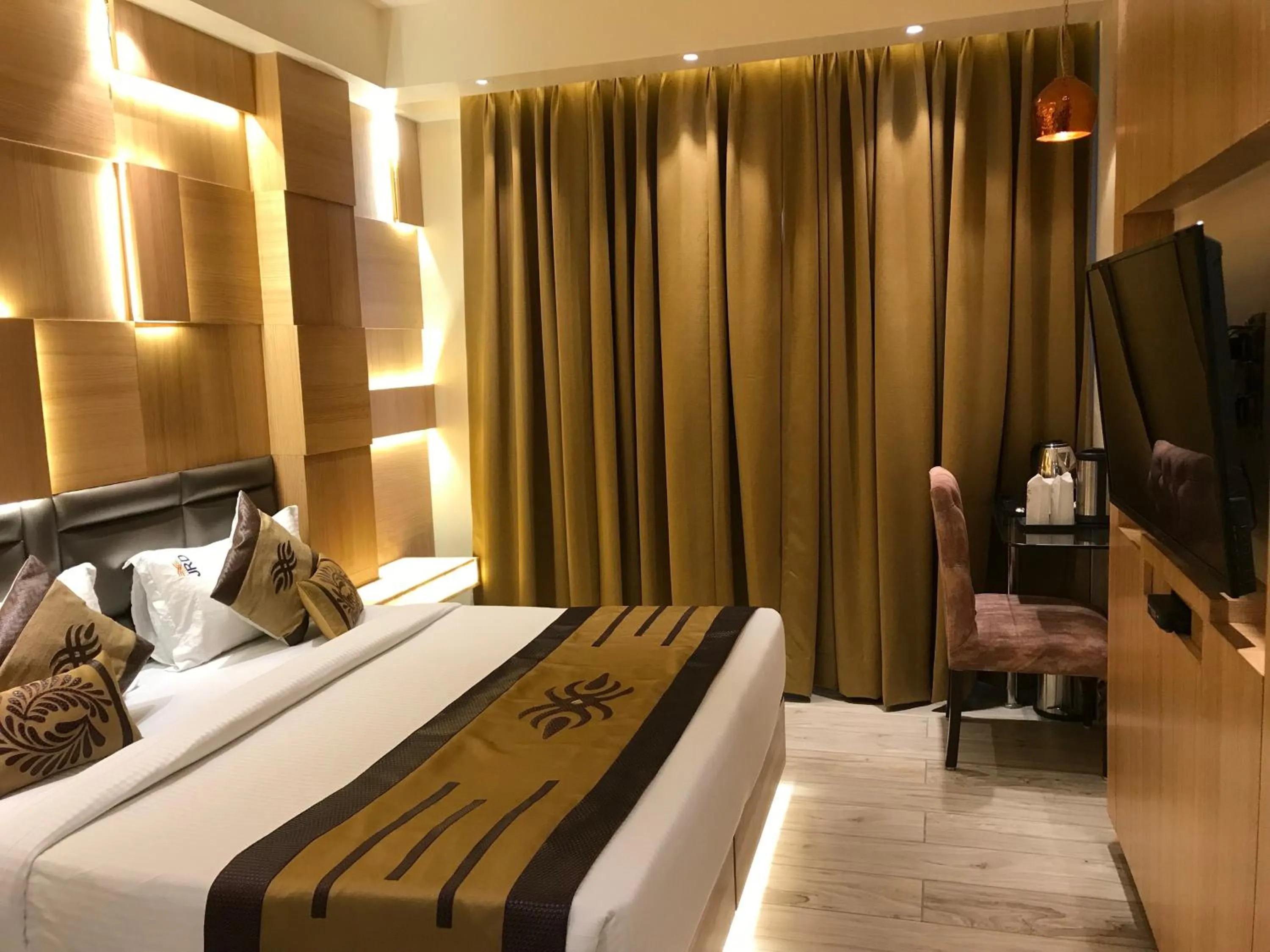 Bed in JRD Pride-Business Hotel