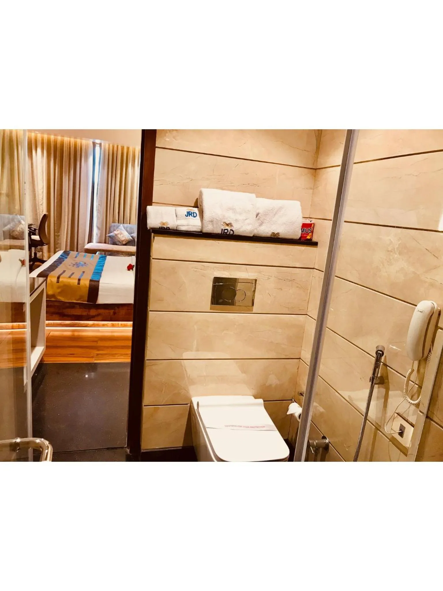 Bed in JRD Pride-Business Hotel