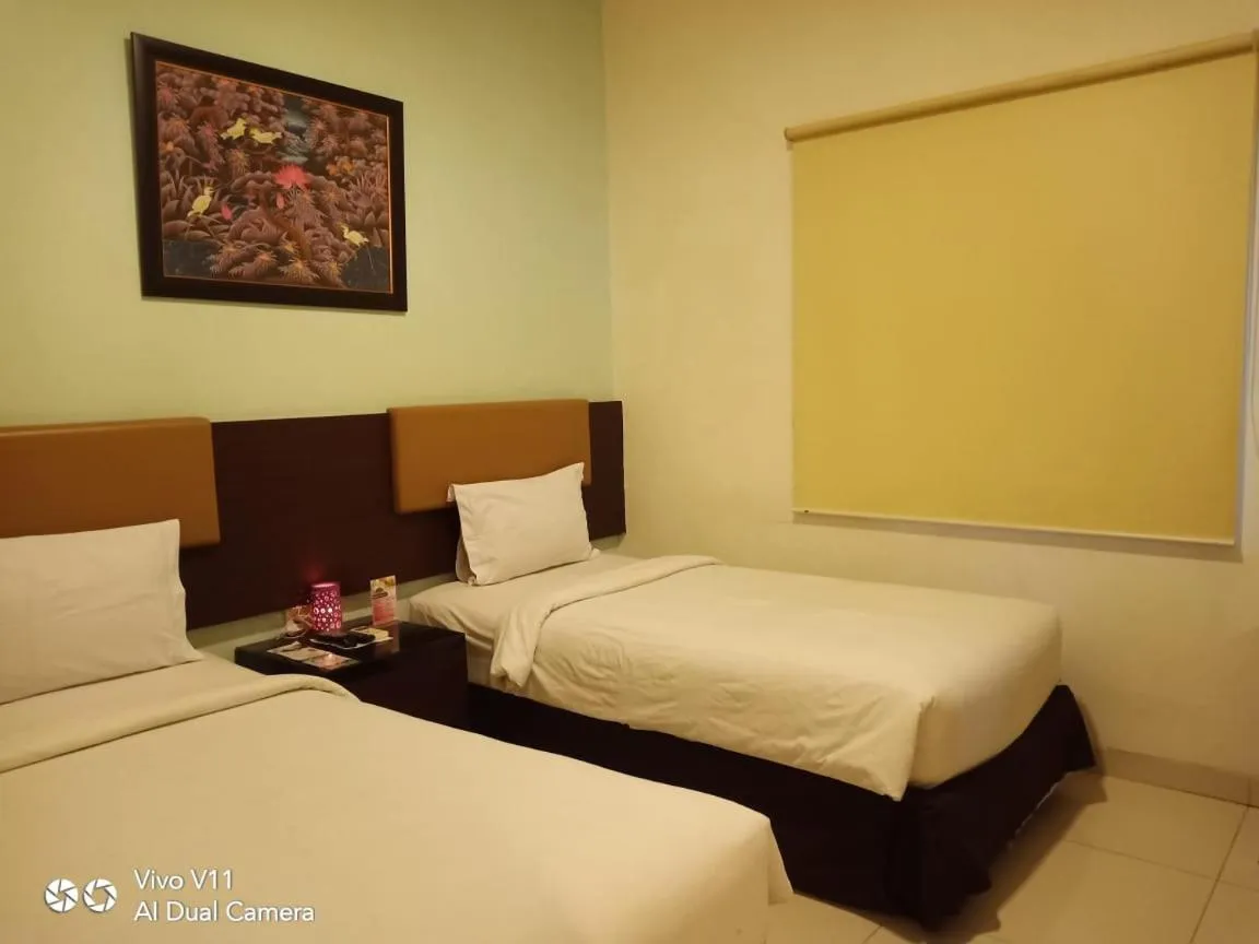 Bed in Ayla City Hotel
