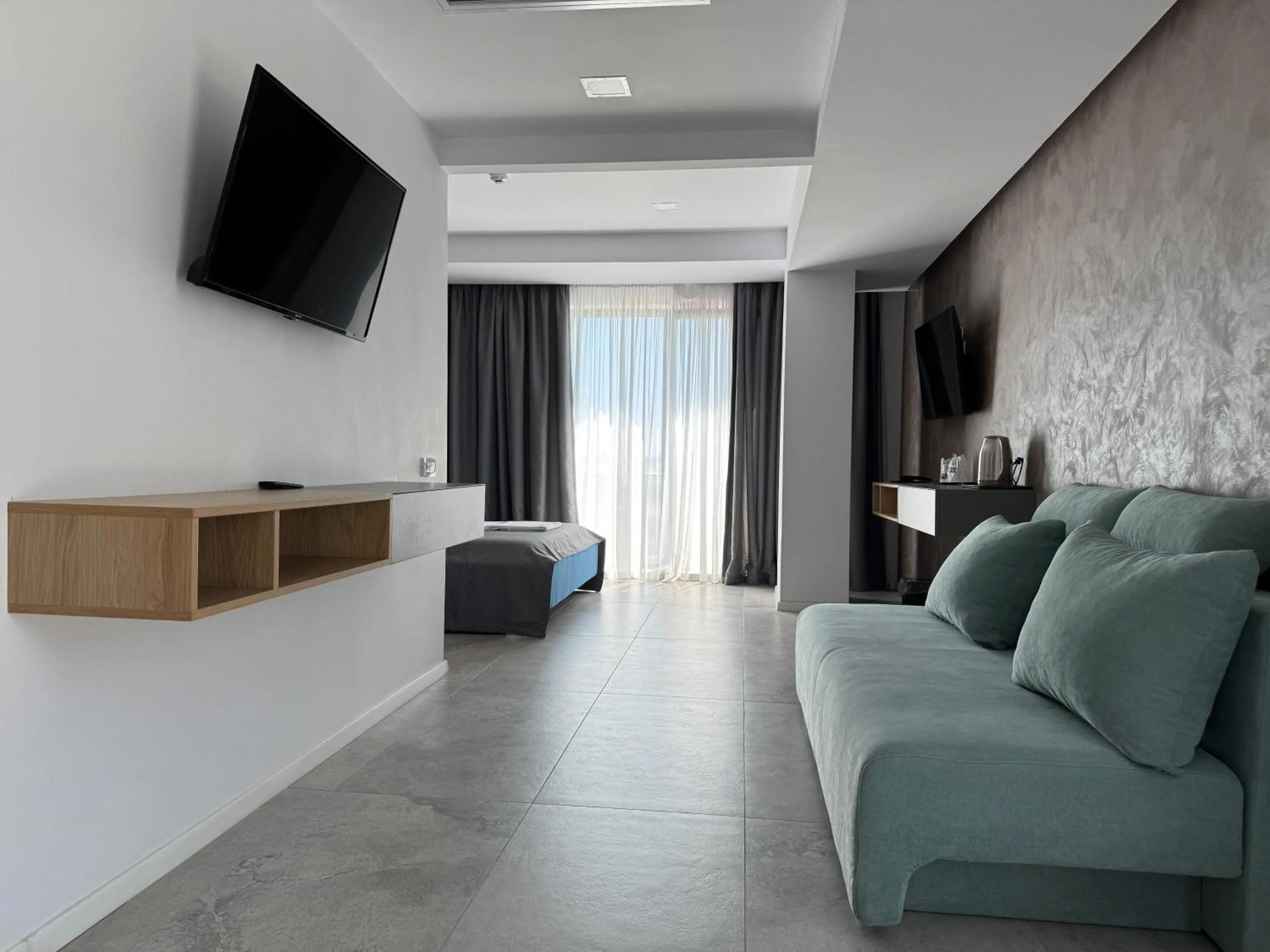 Communal lounge/ TV room in Hotel Prestige
