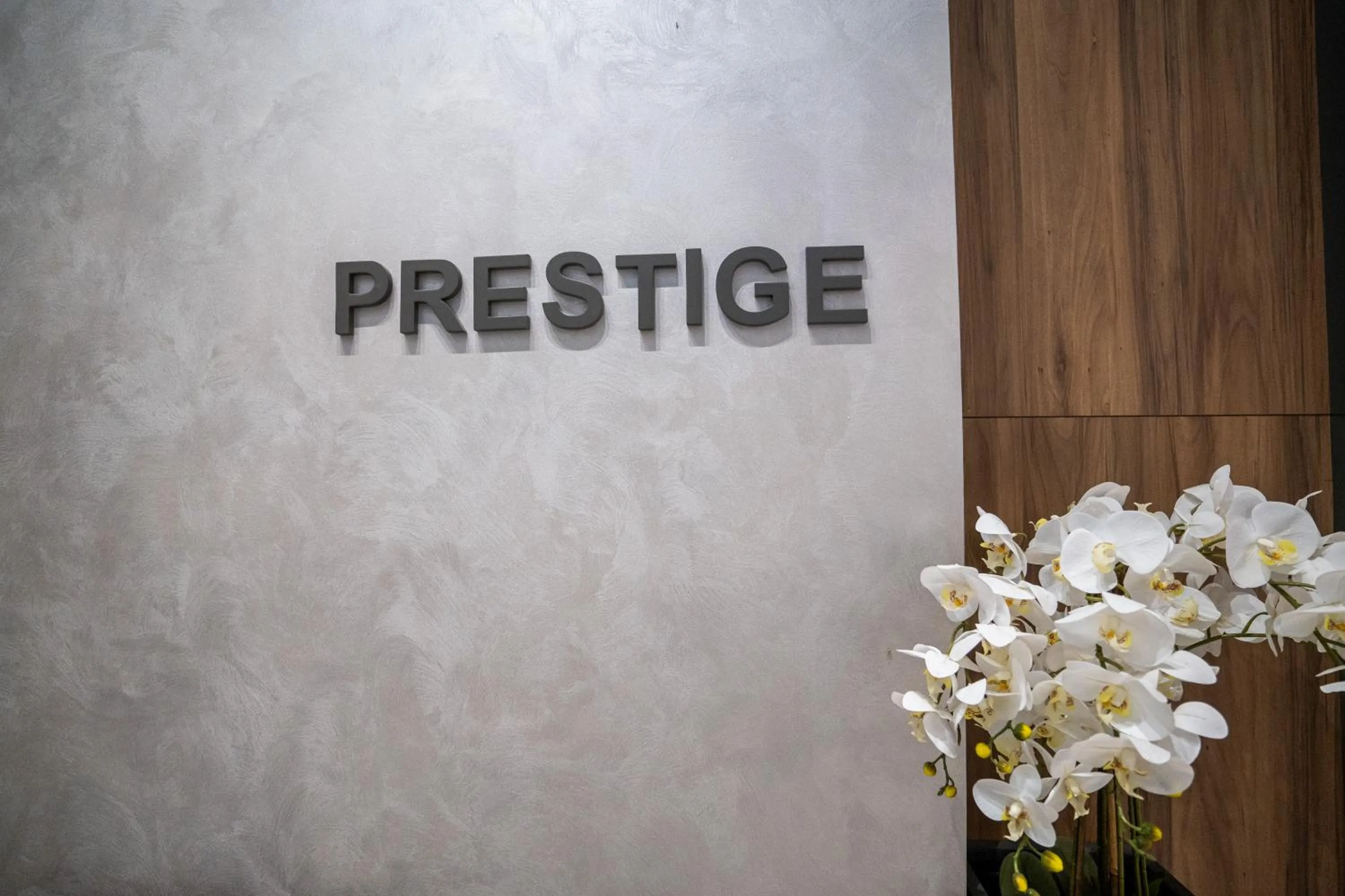 Property logo or sign in Hotel Prestige