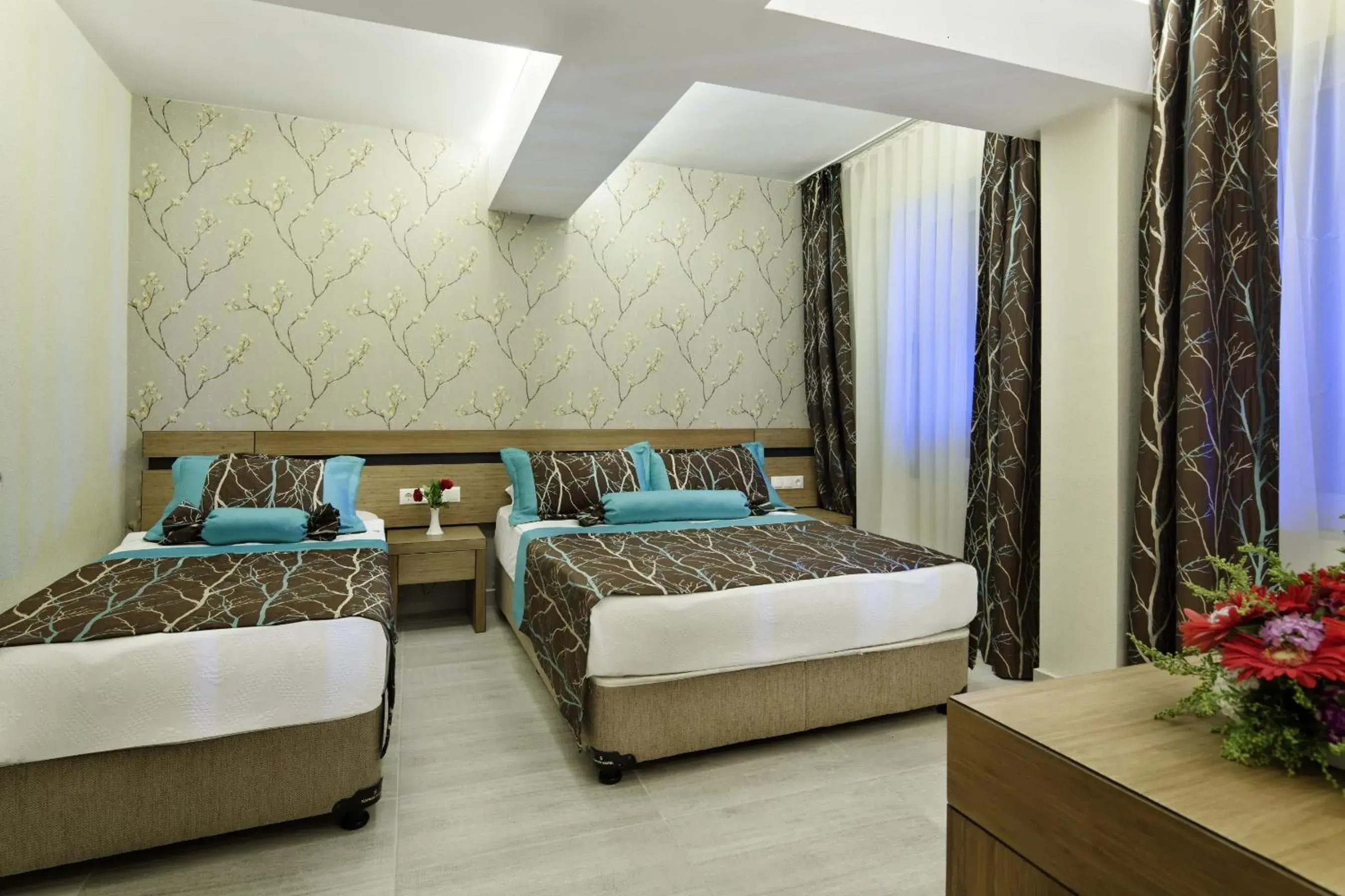 Bed in Saphir Hotel & Villas
