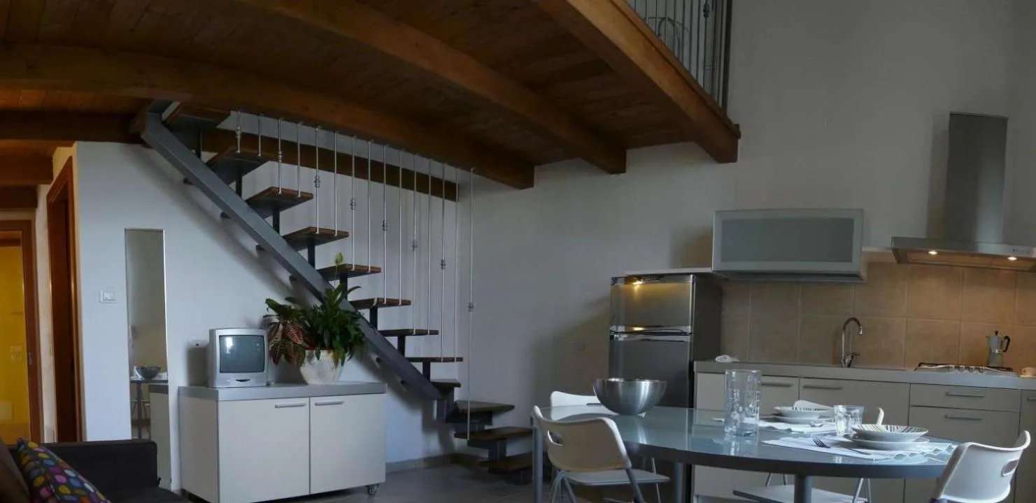 Kitchen or kitchenette in Appartamenti Gardastivo