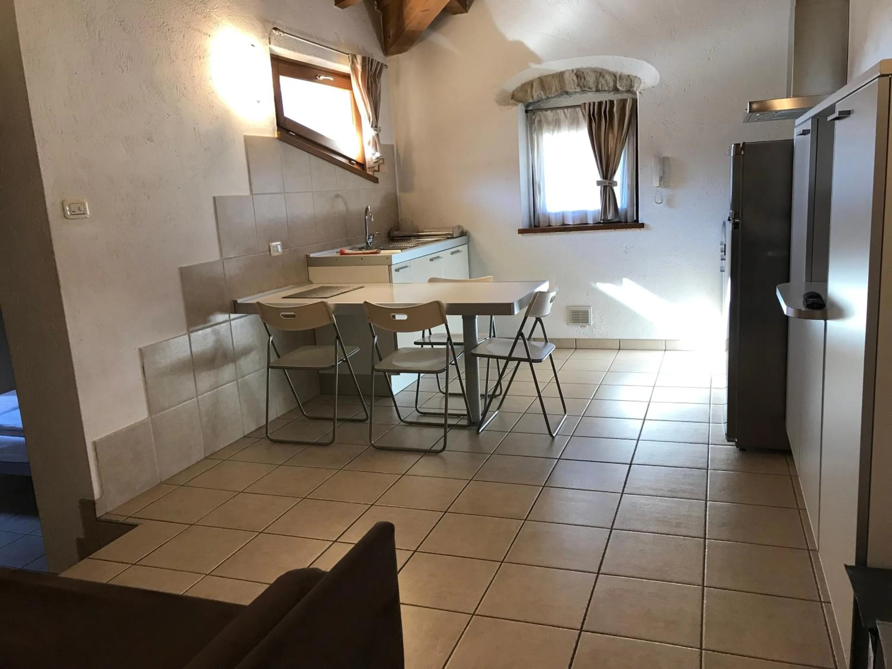 Kitchen or kitchenette in Appartamenti Gardastivo