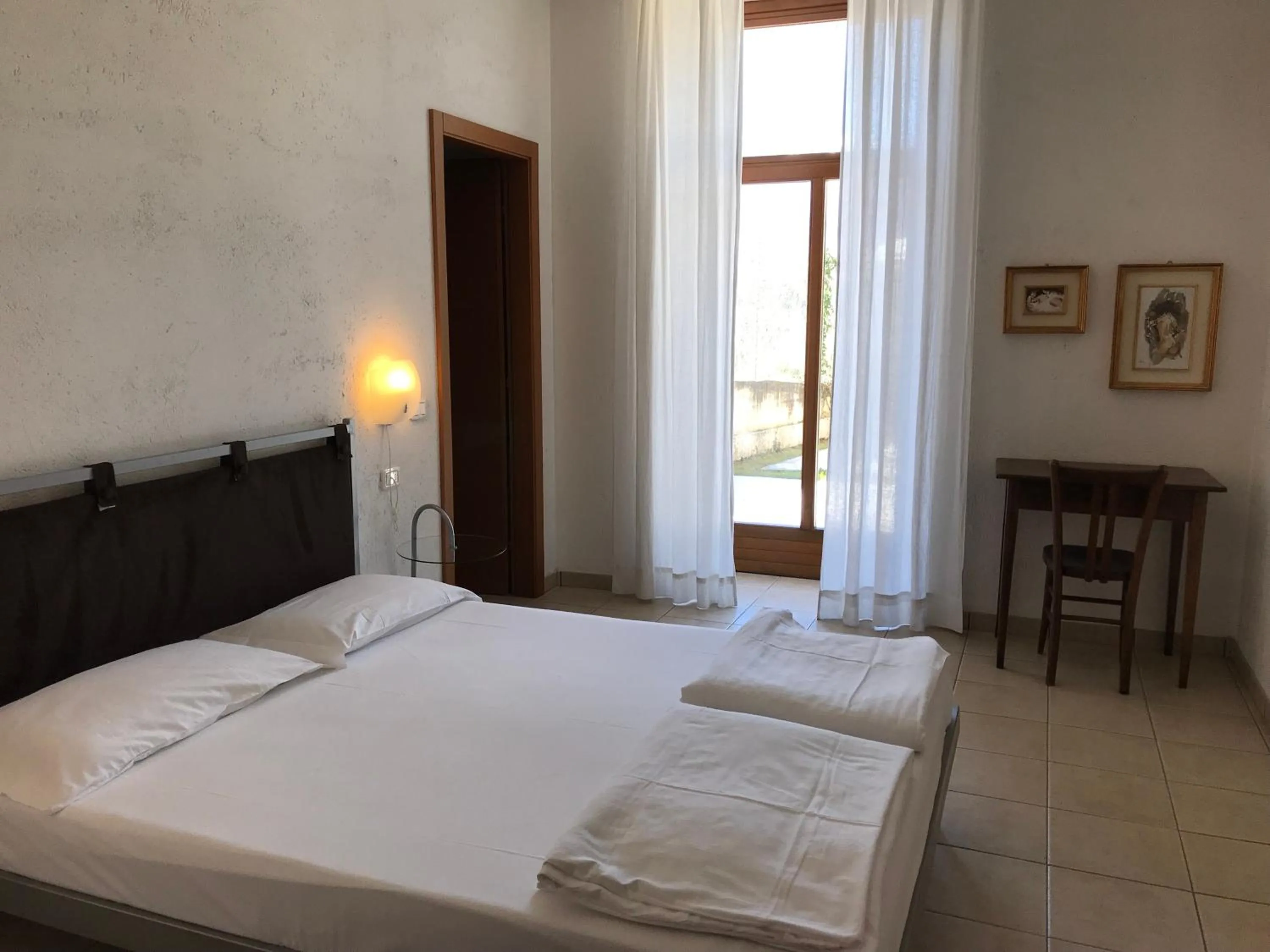 Photo of the whole room, Bed in Appartamenti Gardastivo
