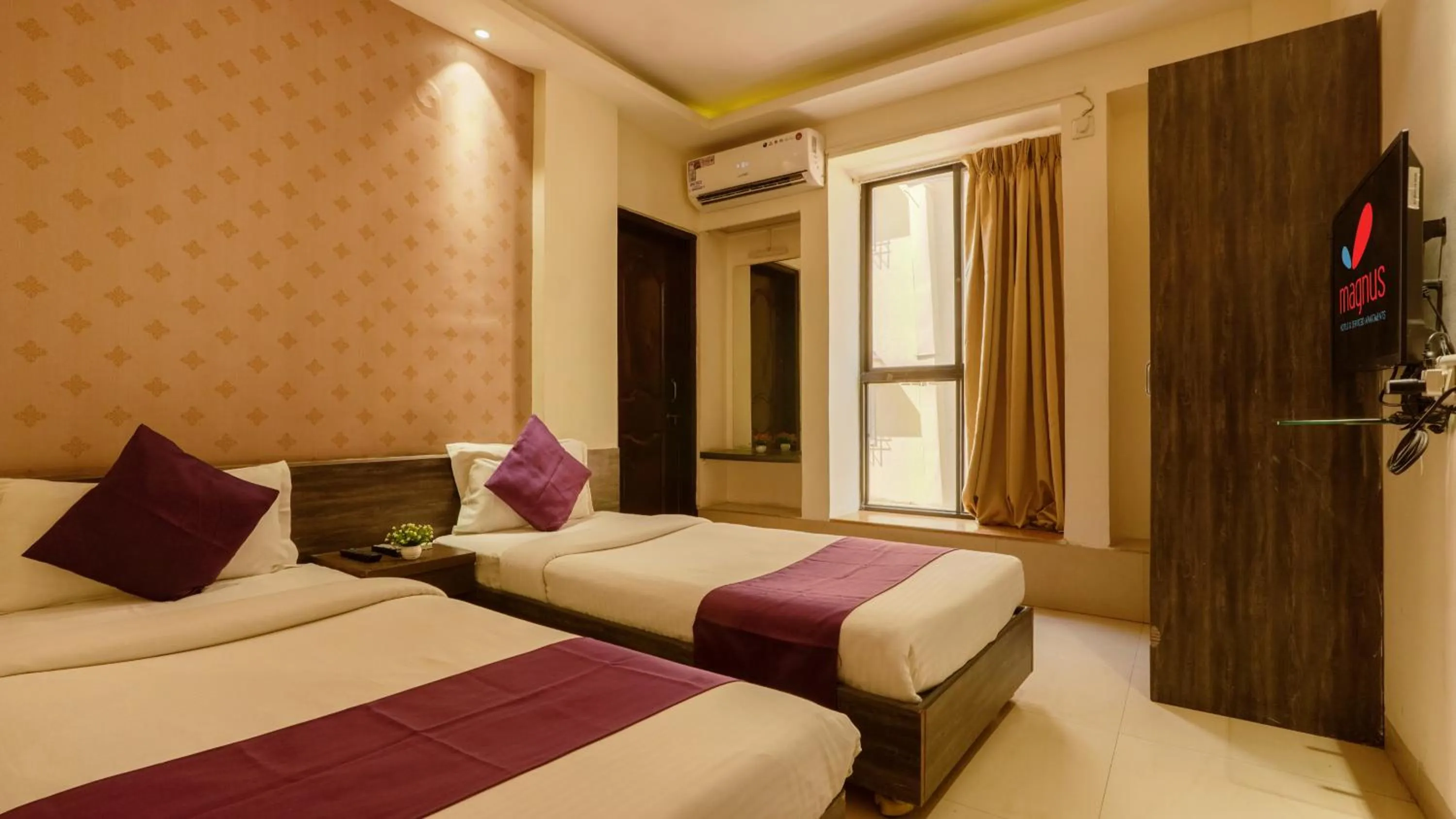Bed in Magnus Calypso Suites Viman Nagar
