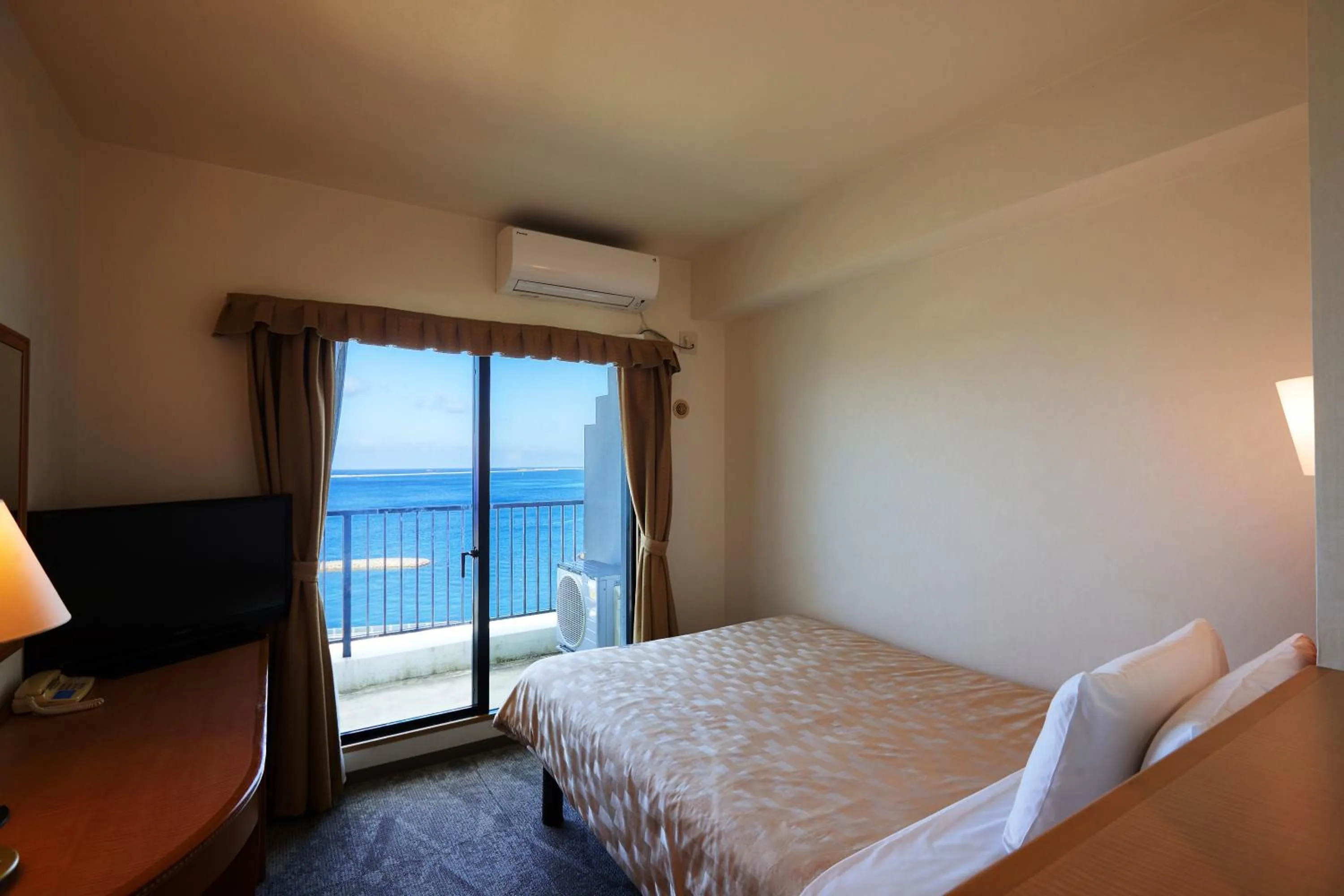 Photo of the whole room, Bed in Naha Beach Side Hotel