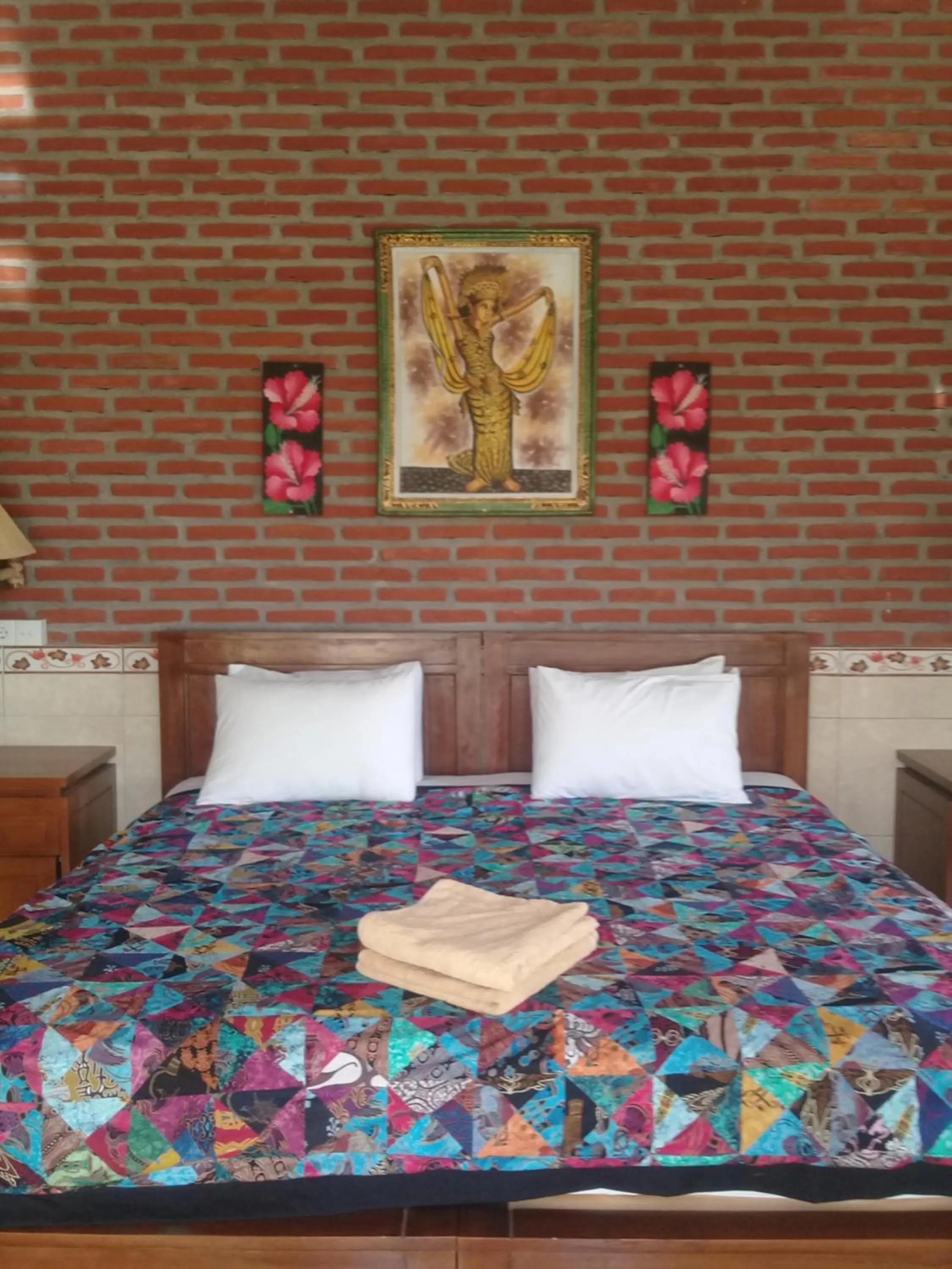Bed in Eliska Sari Bungalows Sumberkima