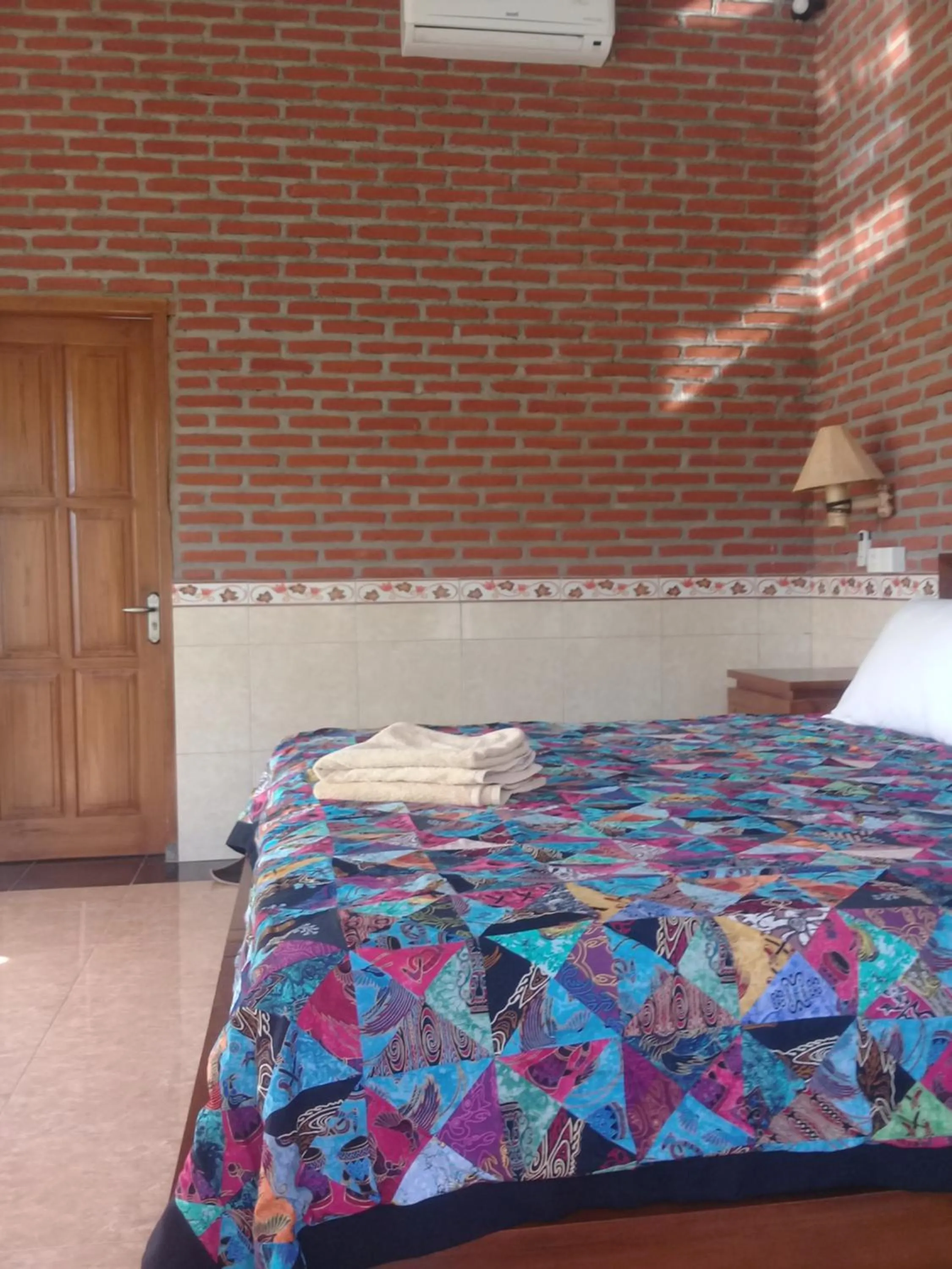 Bed in Eliska Sari Bungalows Sumberkima