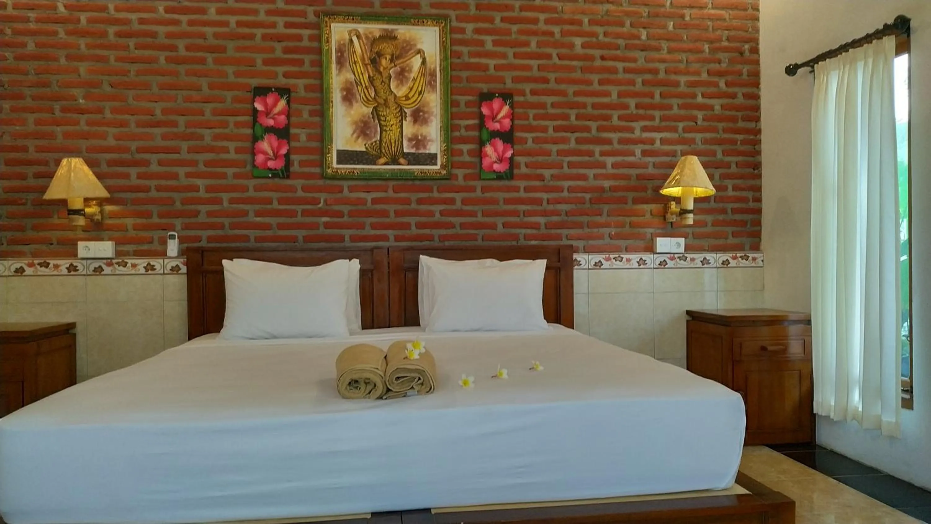 Bed in Eliska Sari Bungalows Sumberkima