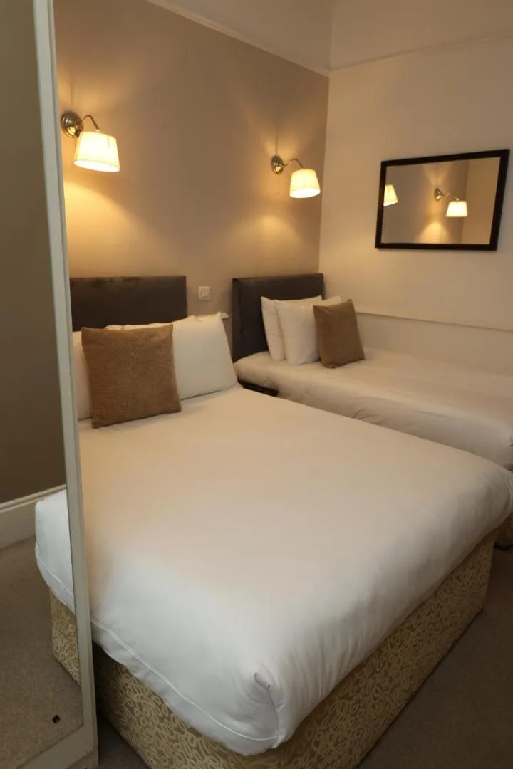 Bed in Maples House Hotel