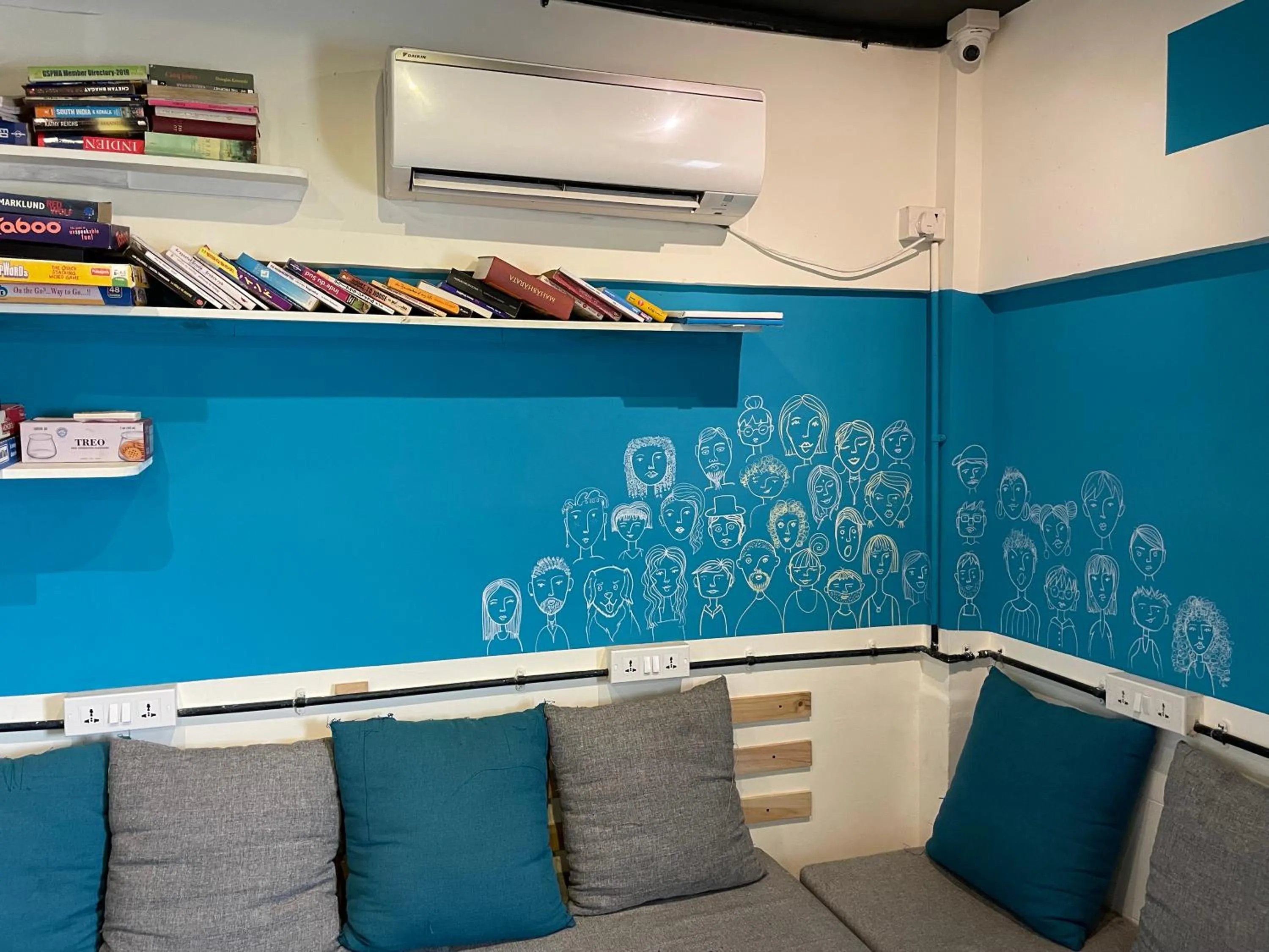 Communal lounge/ TV room in Locomo Hostel OG - Stay Work Eat