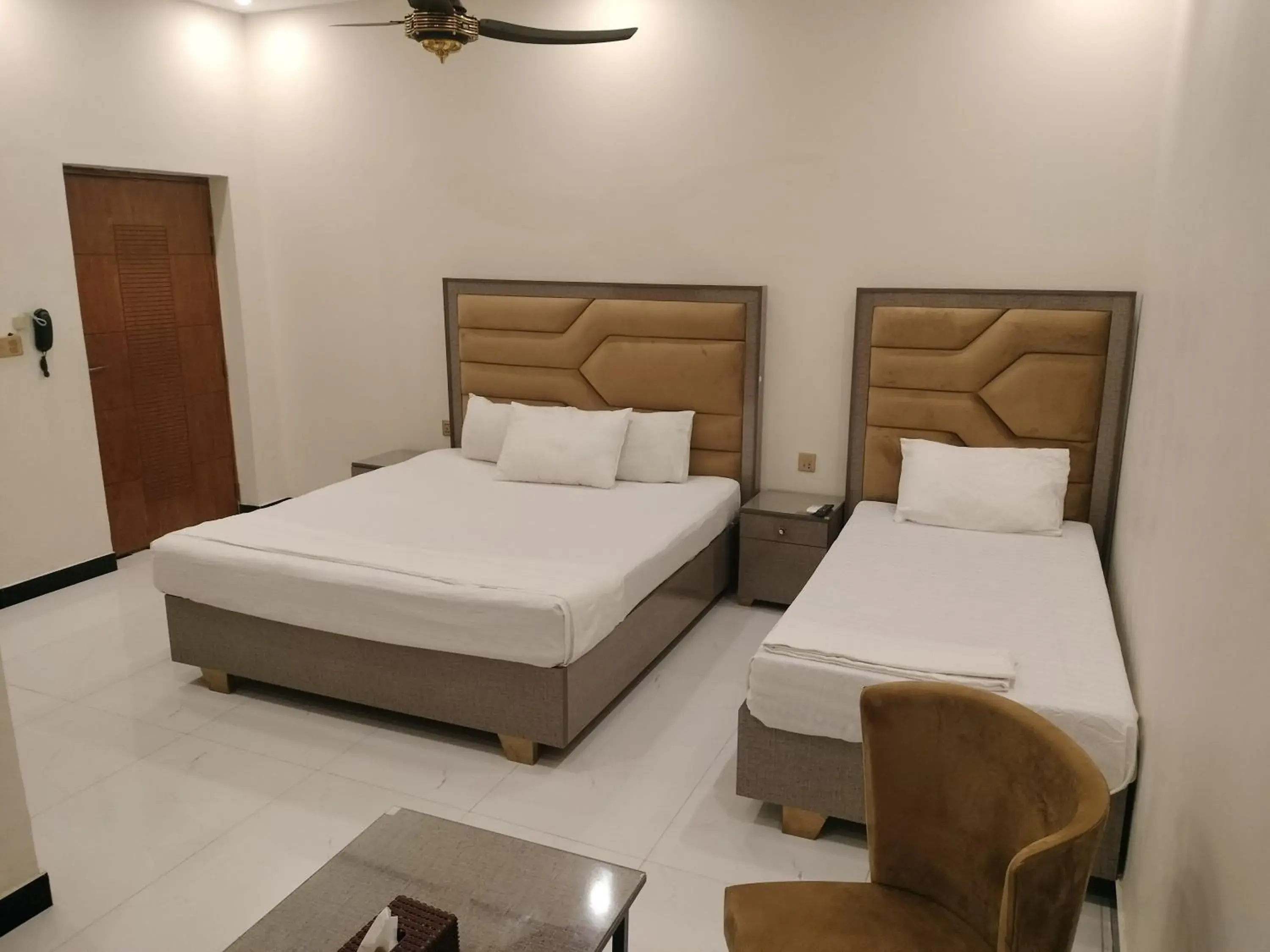 Deluxe Triple Room in Dove Inn Hotel Kalma Chowk Deluxe Triple Room in Dove Inn Hotel Kalma Chowk