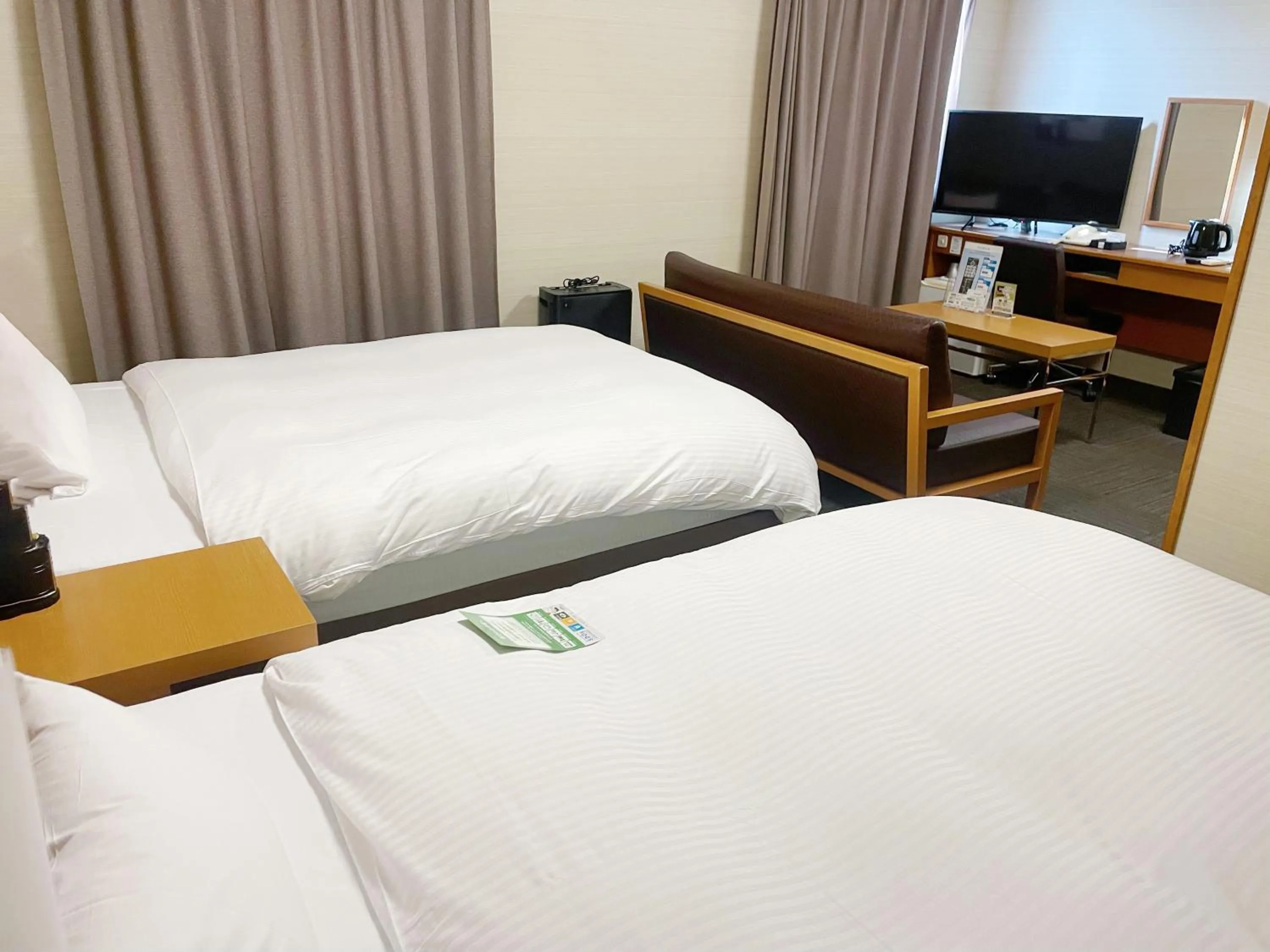 Photo of the whole room, Bed in Hotel Route-Inn Nagaizumi Numazu Inter 2