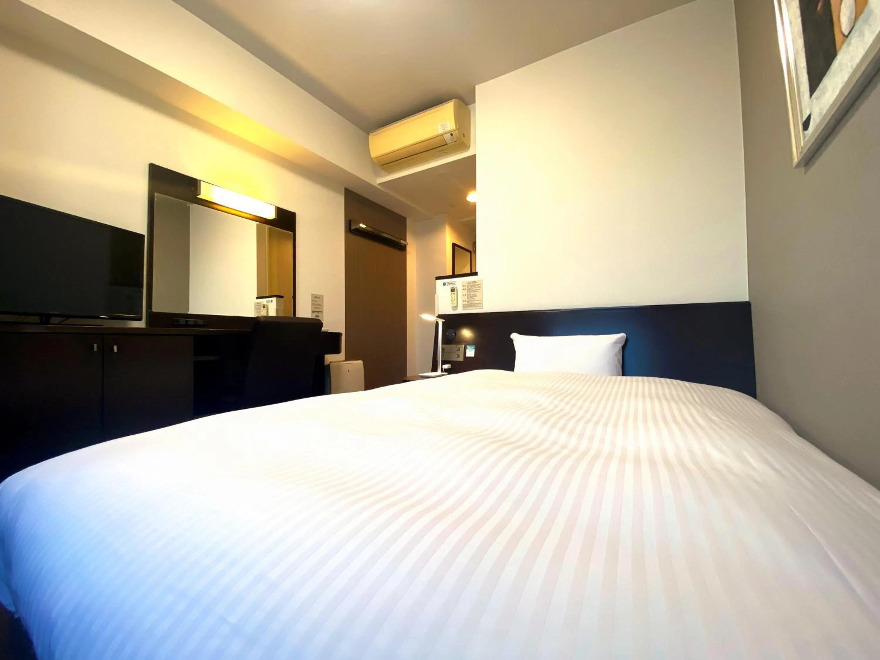 Photo of the whole room, Bed in Hotel Route-Inn Ashikaga Ekimae