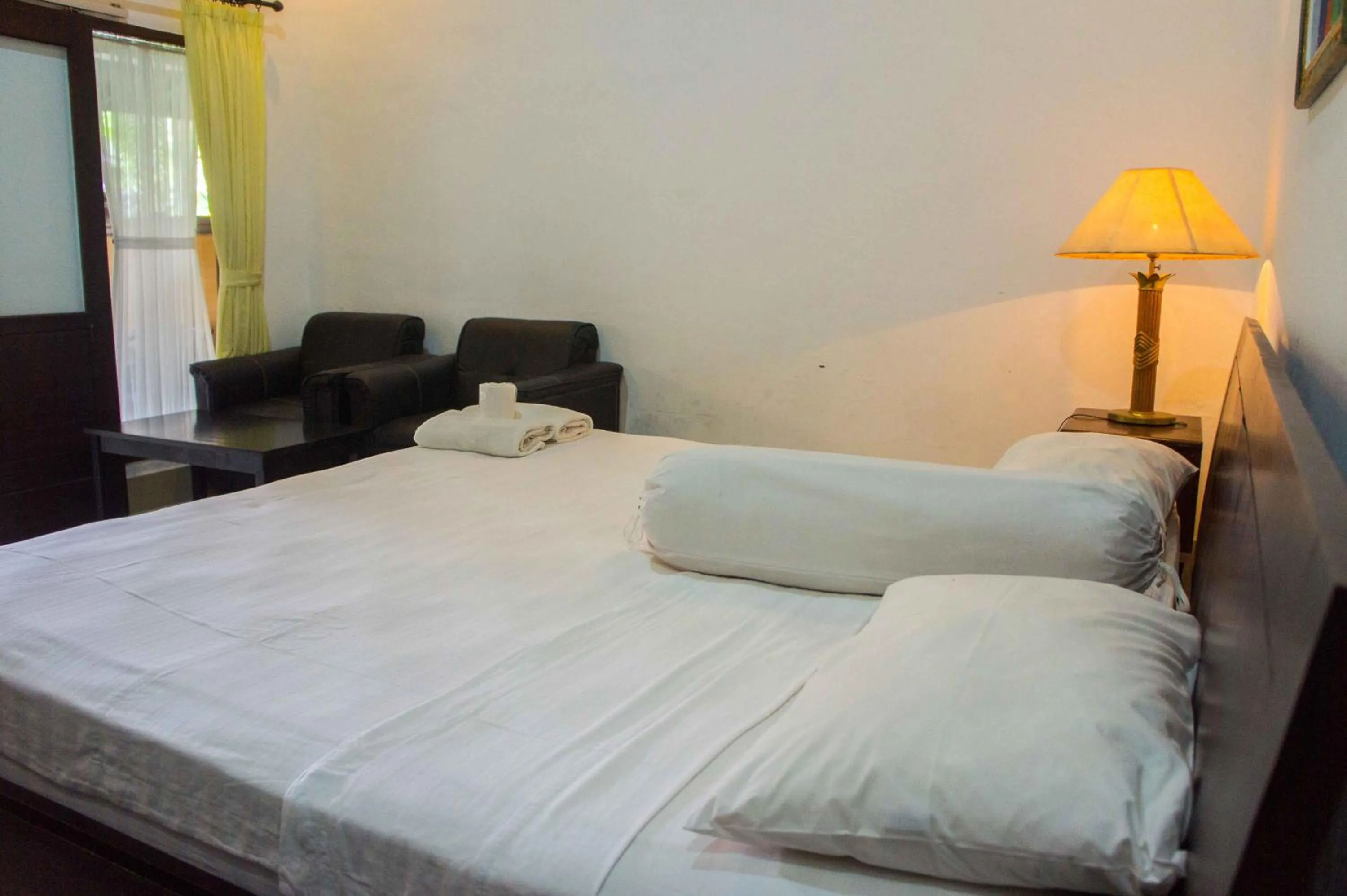 Bed in Putu Guest House