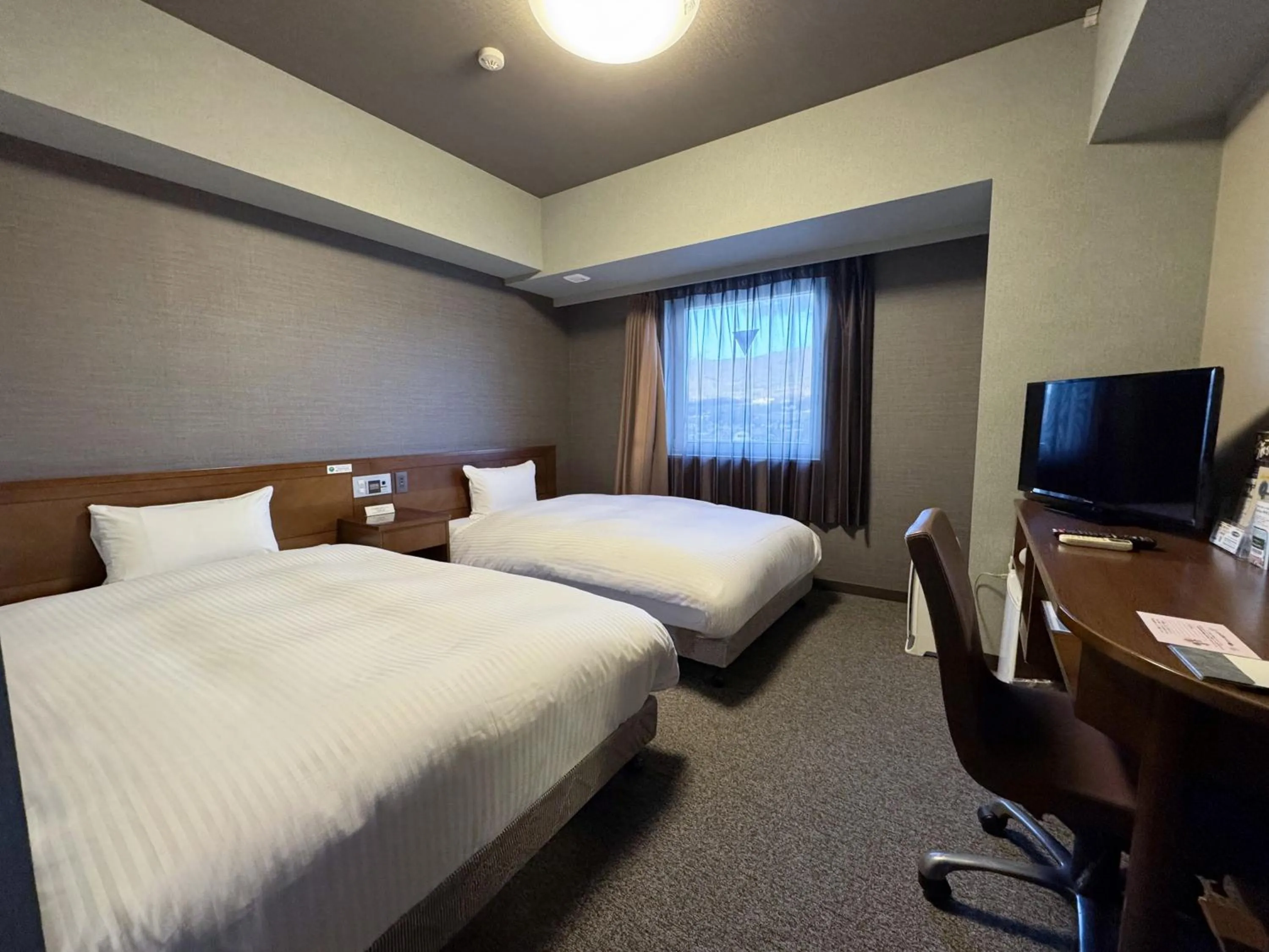 Photo of the whole room, Bed in Hotel Route-Inn Shiojiri