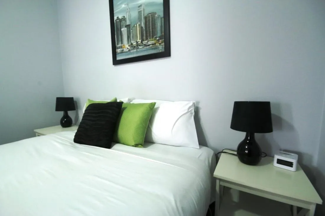 Bed in Golden Palms Motel