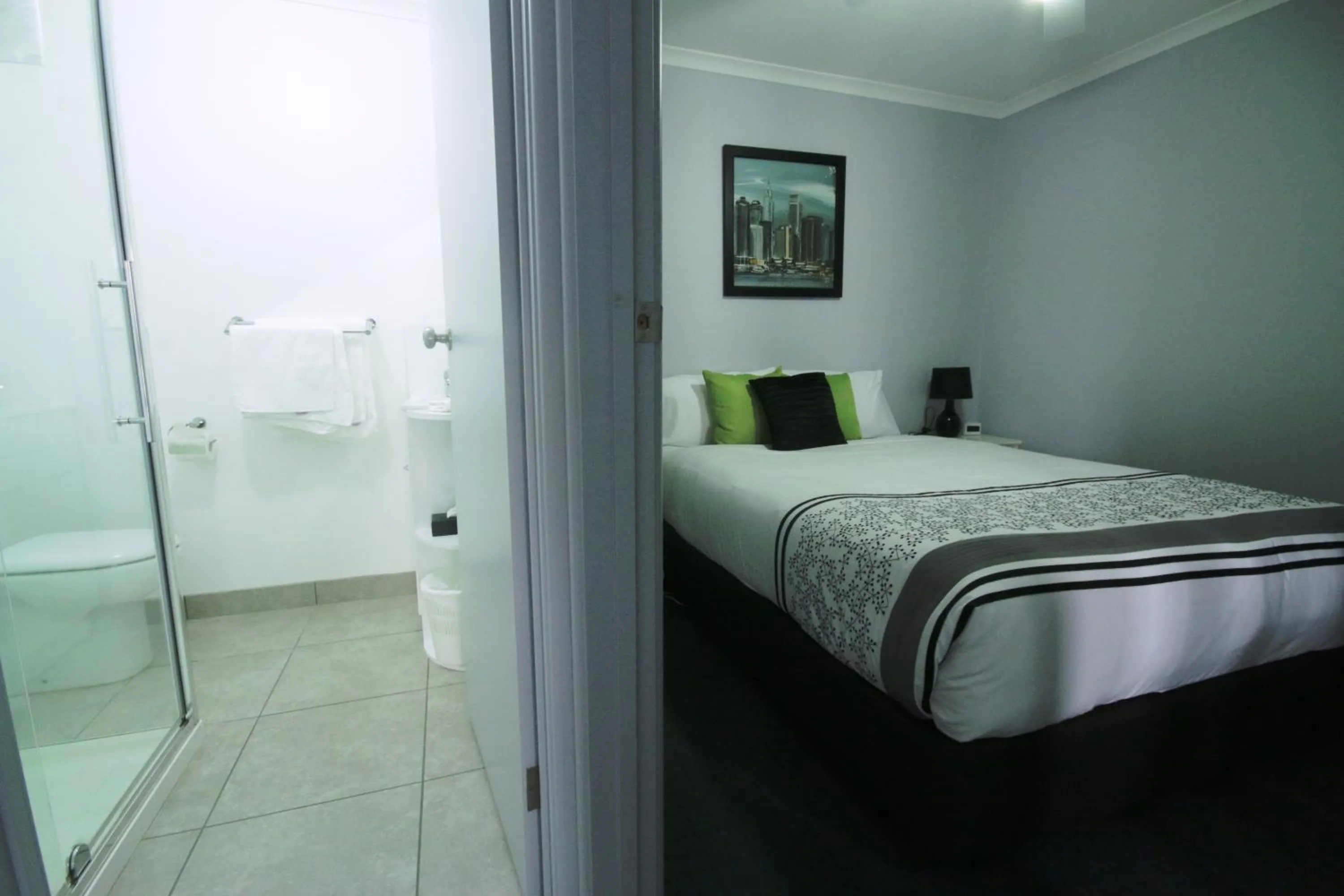 Bed in Golden Palms Motel