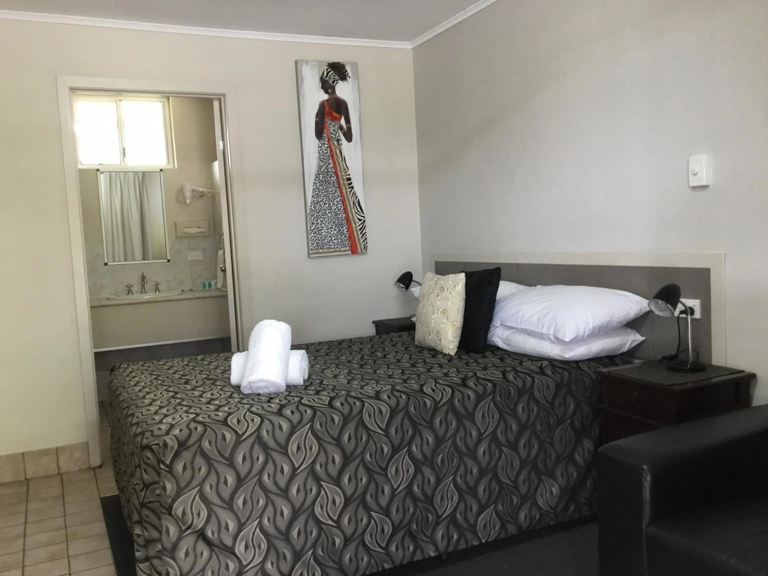 Bed in Golden Palms Motor Inn