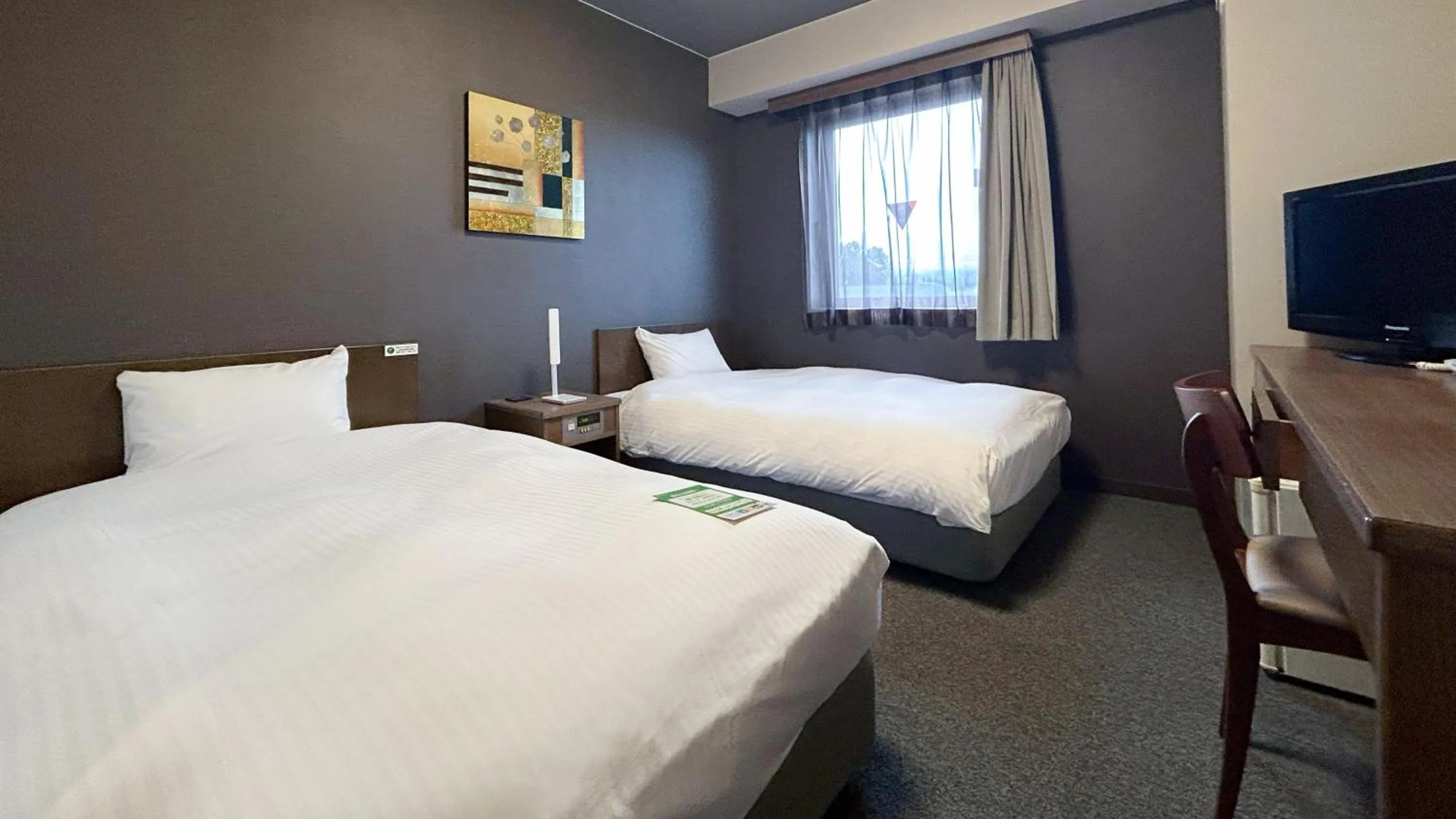 Bed in Hotel Route-Inn Myoko Arai