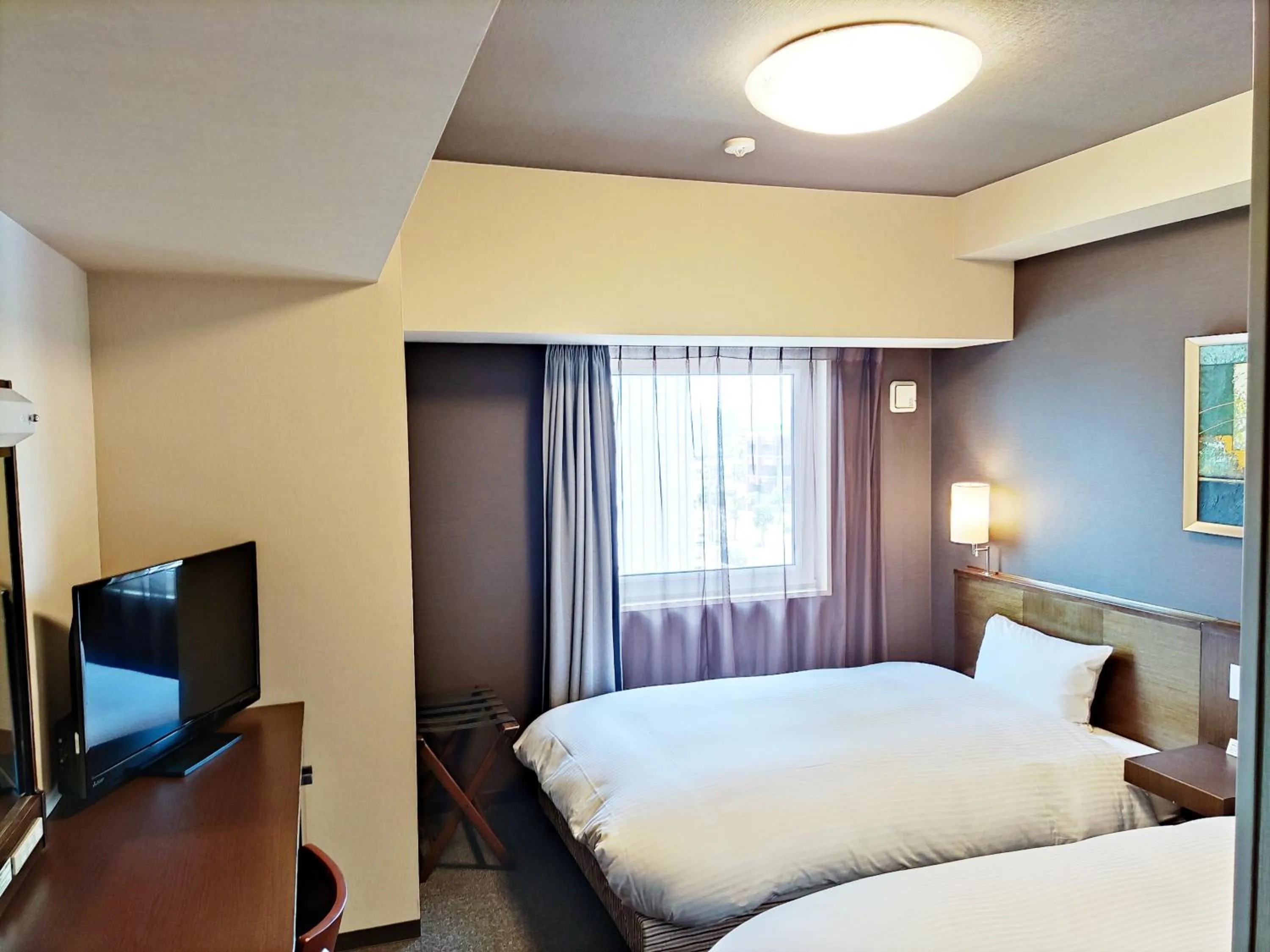 Photo of the whole room, Bed in Hotel Route-Inn Gifuhashima Ekimae