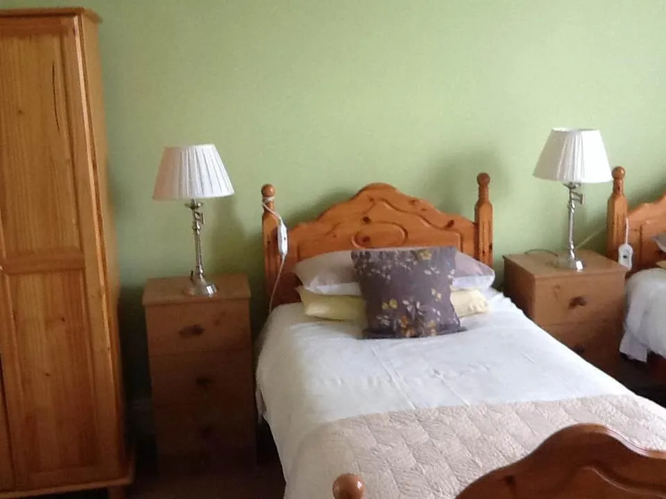 Bed in The Old Cable Historic House & Seafood Restaurant
