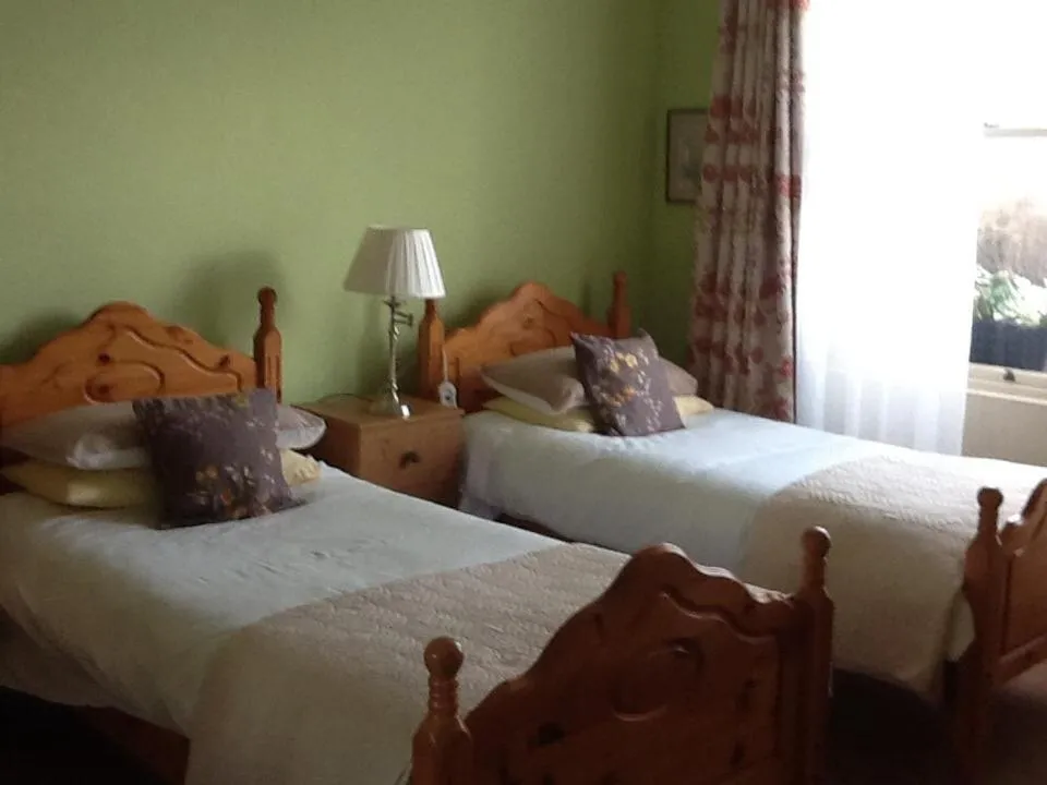 Bed in The Old Cable Historic House & Seafood Restaurant