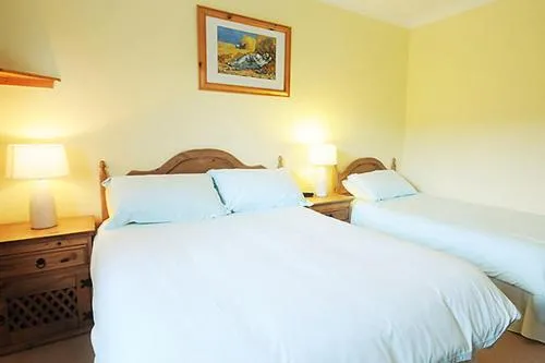 Bedroom, Bed in The Old Cable Historic House & Seafood Restaurant