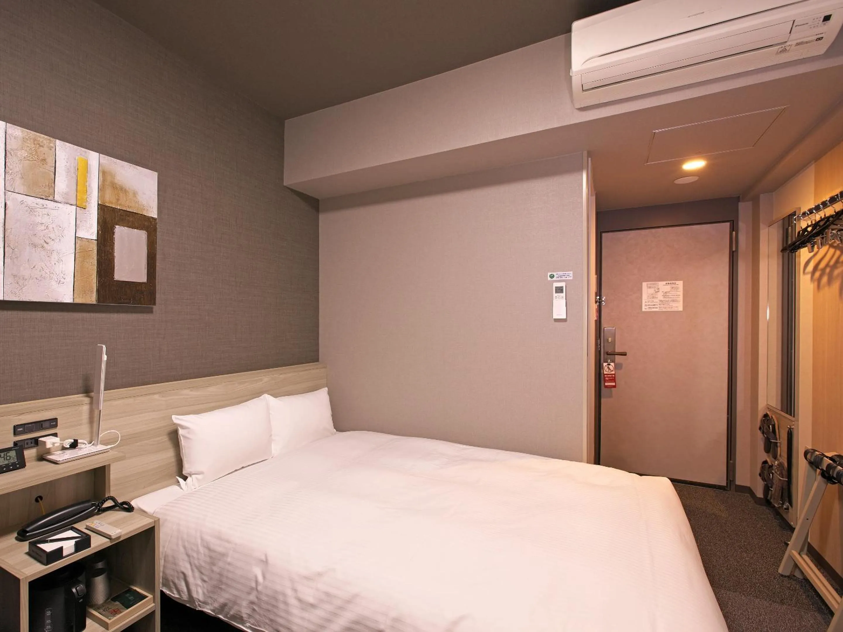 Photo of the whole room, Bed in Hotel Route-Inn Toyama Ekimae