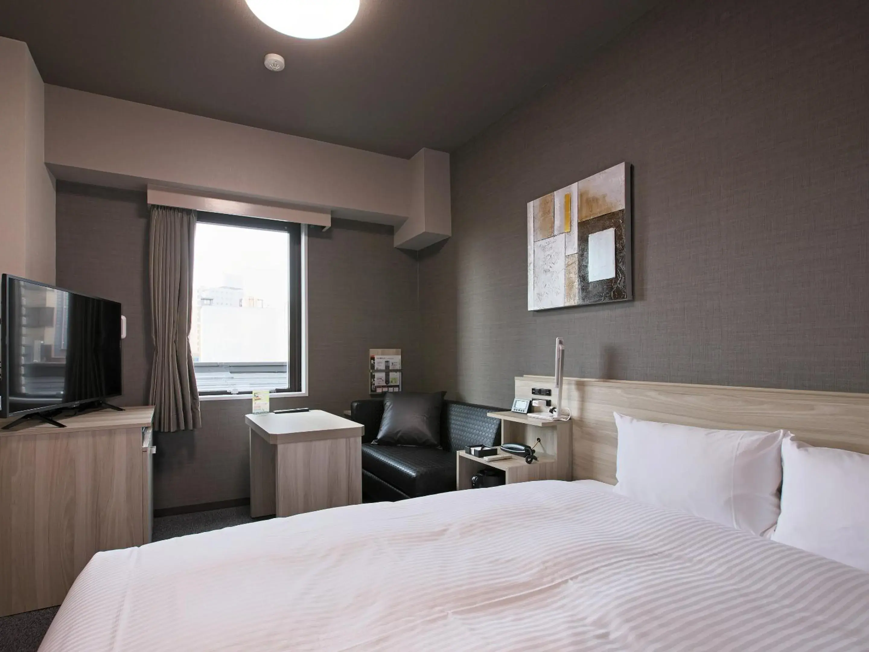 Photo of the whole room, Bed in Hotel Route-Inn Toyama Ekimae