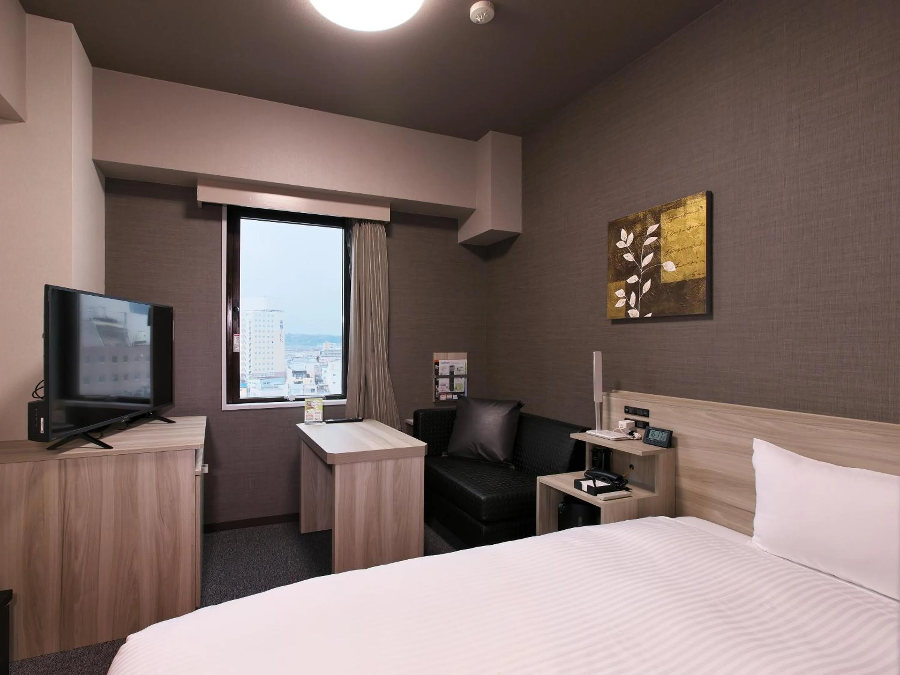 Photo of the whole room, Bed in Hotel Route-Inn Toyama Ekimae