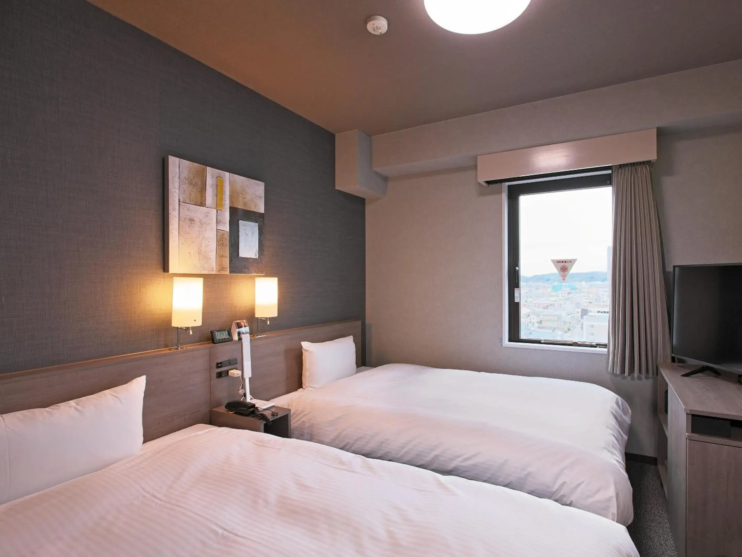 Photo of the whole room, Bed in Hotel Route-Inn Toyama Ekimae